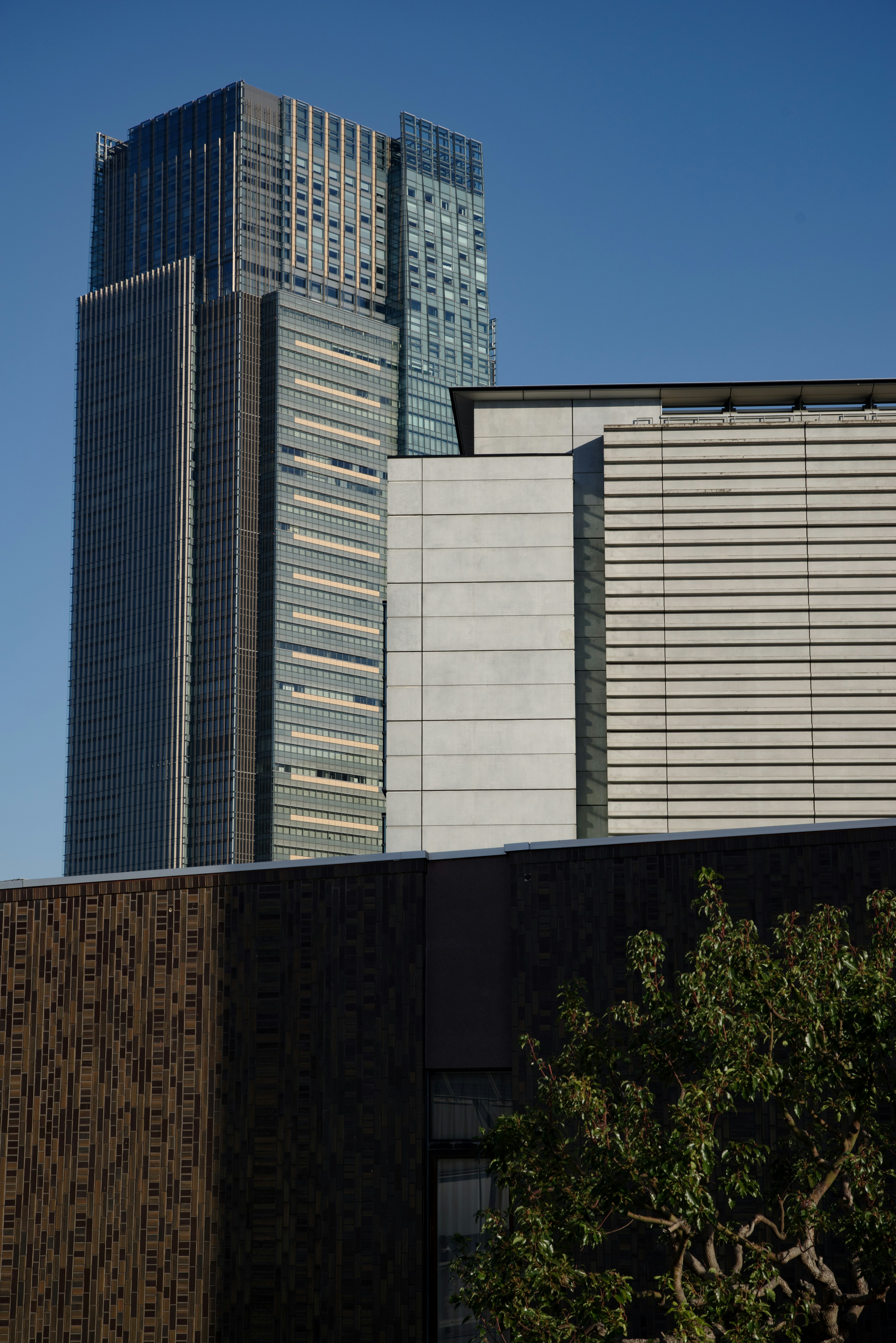 View of modern skyscrapers against a clear blue sky