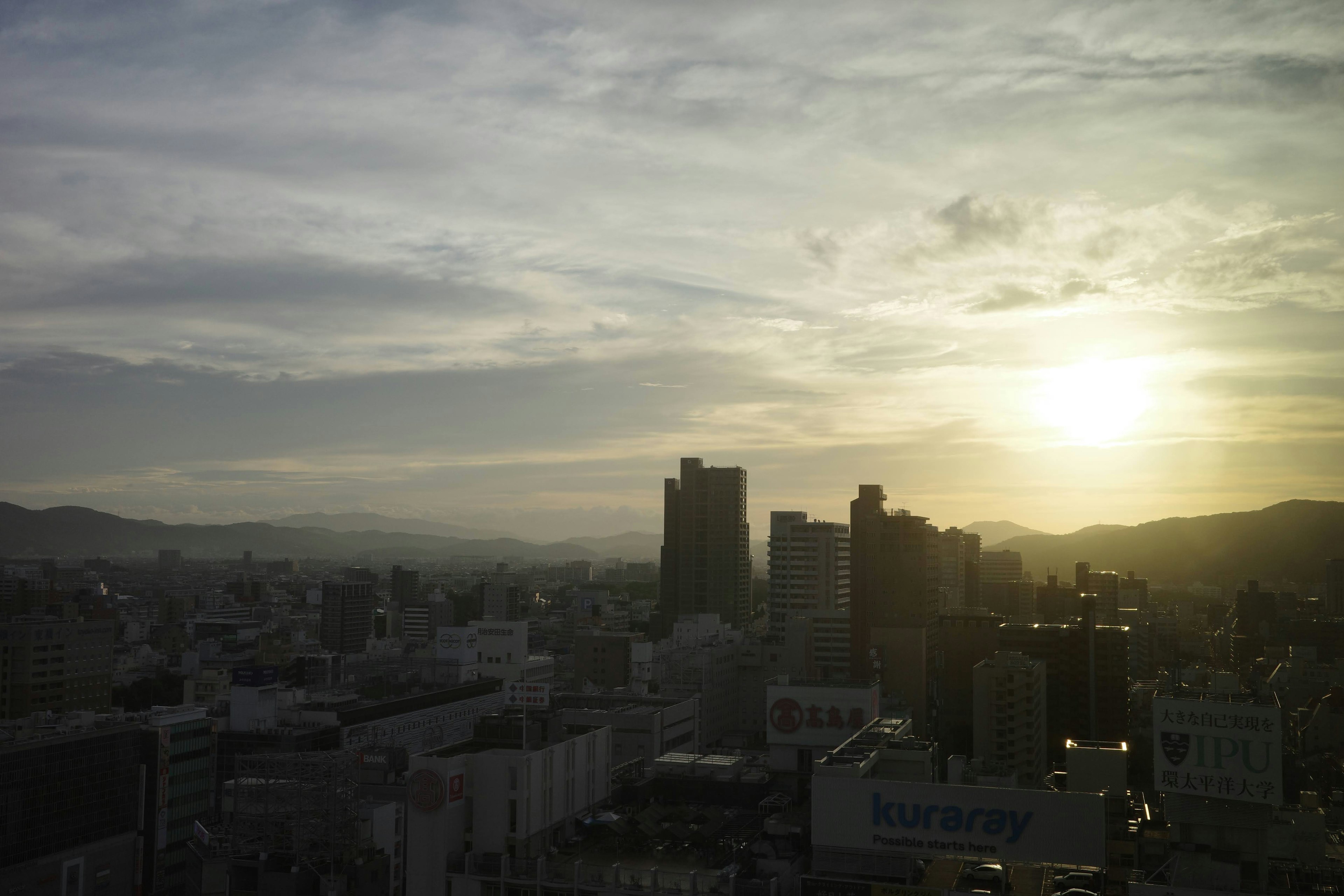 Cityscape at sunset with high-rise buildings