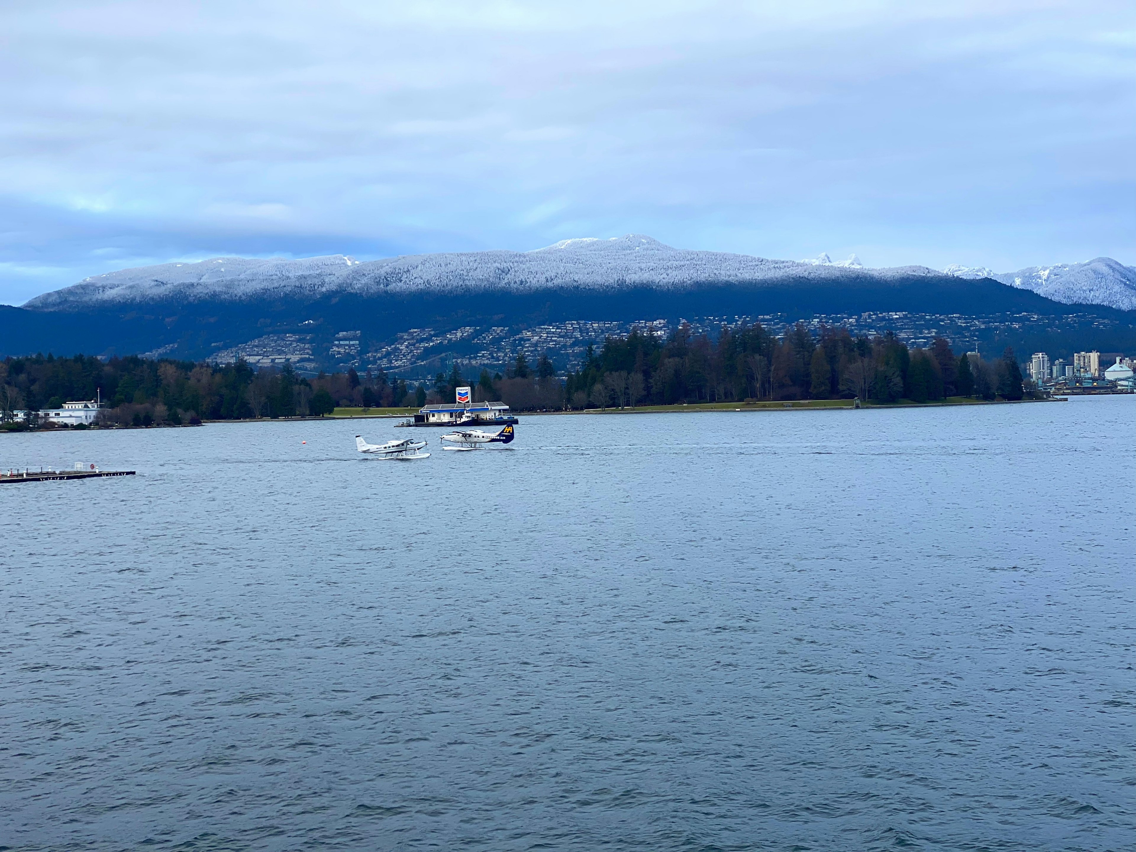 Scenic view of snow-capped mountains and calm water