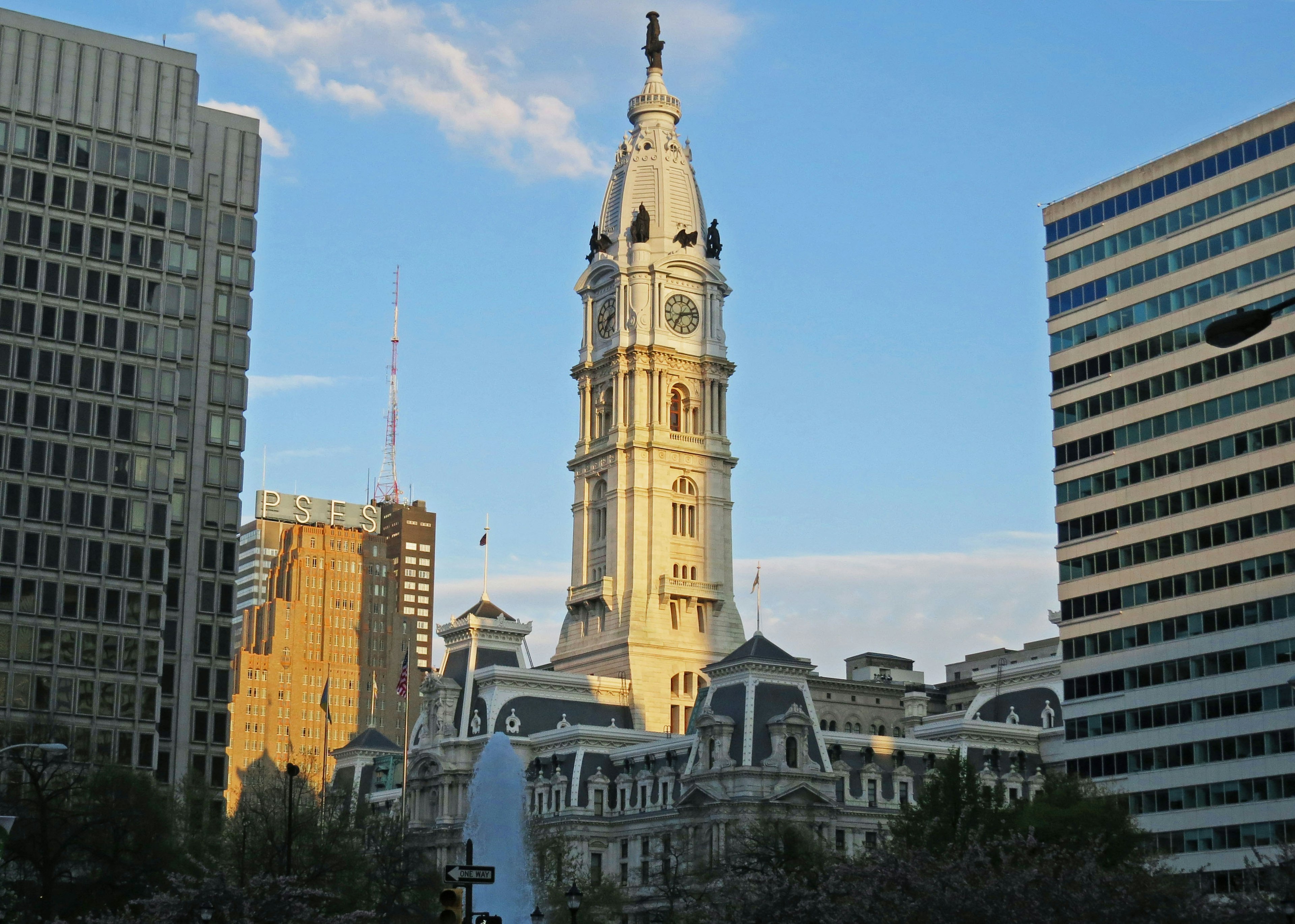 Philadelphia City Hall tower rising against a blue sky