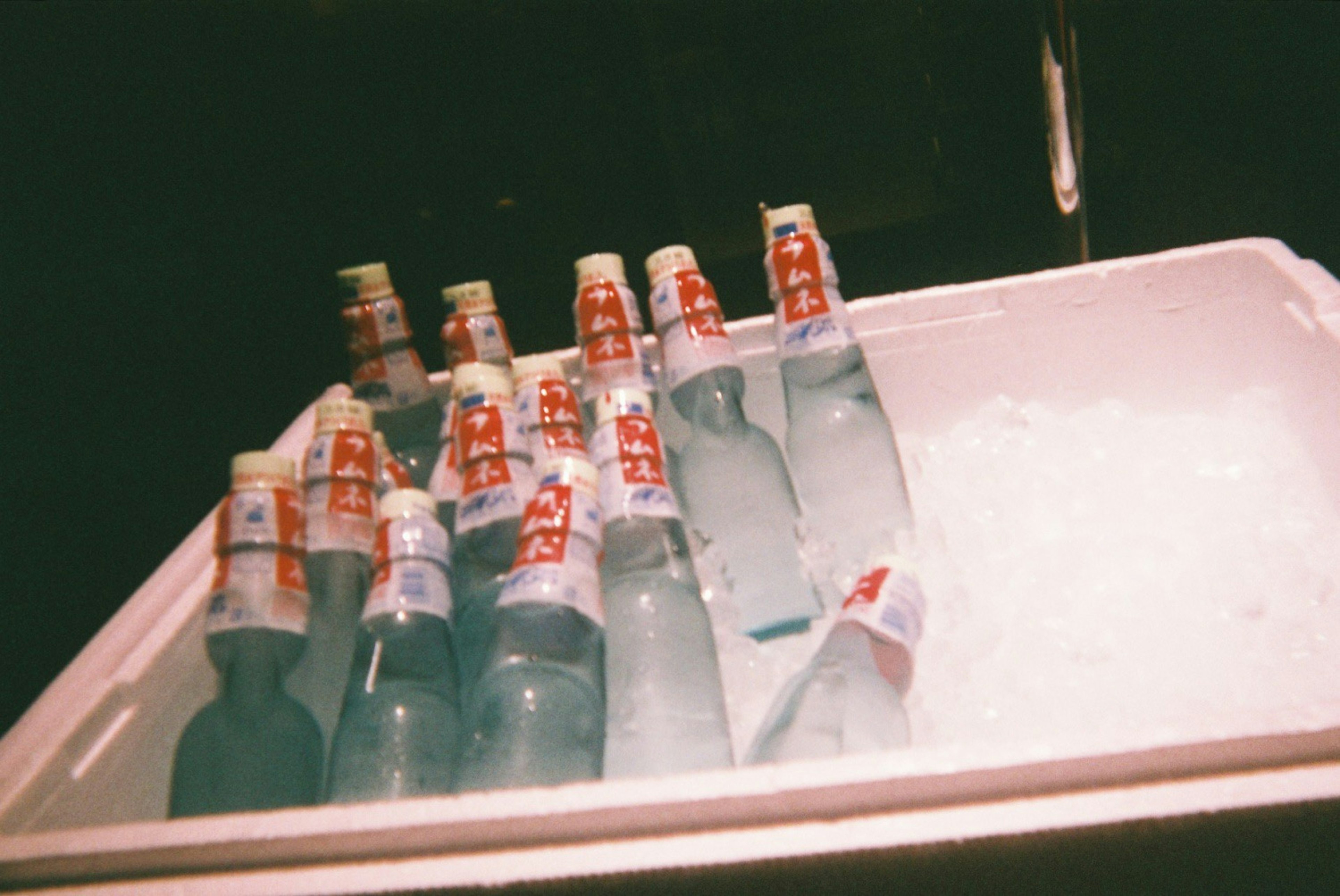 Bottled drinks placed in ice in a cooler