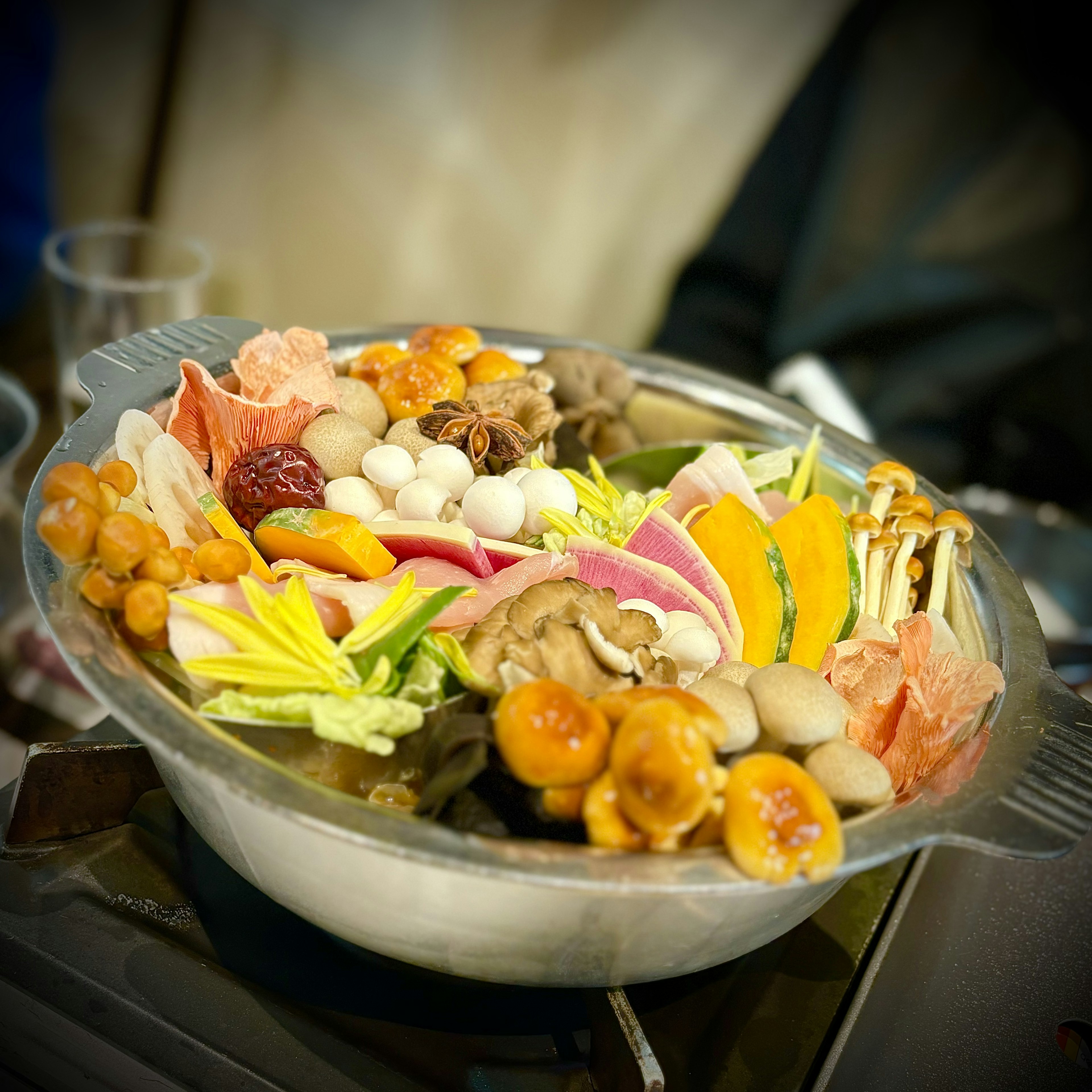 A colorful assortment of vegetables and mushrooms in a pot