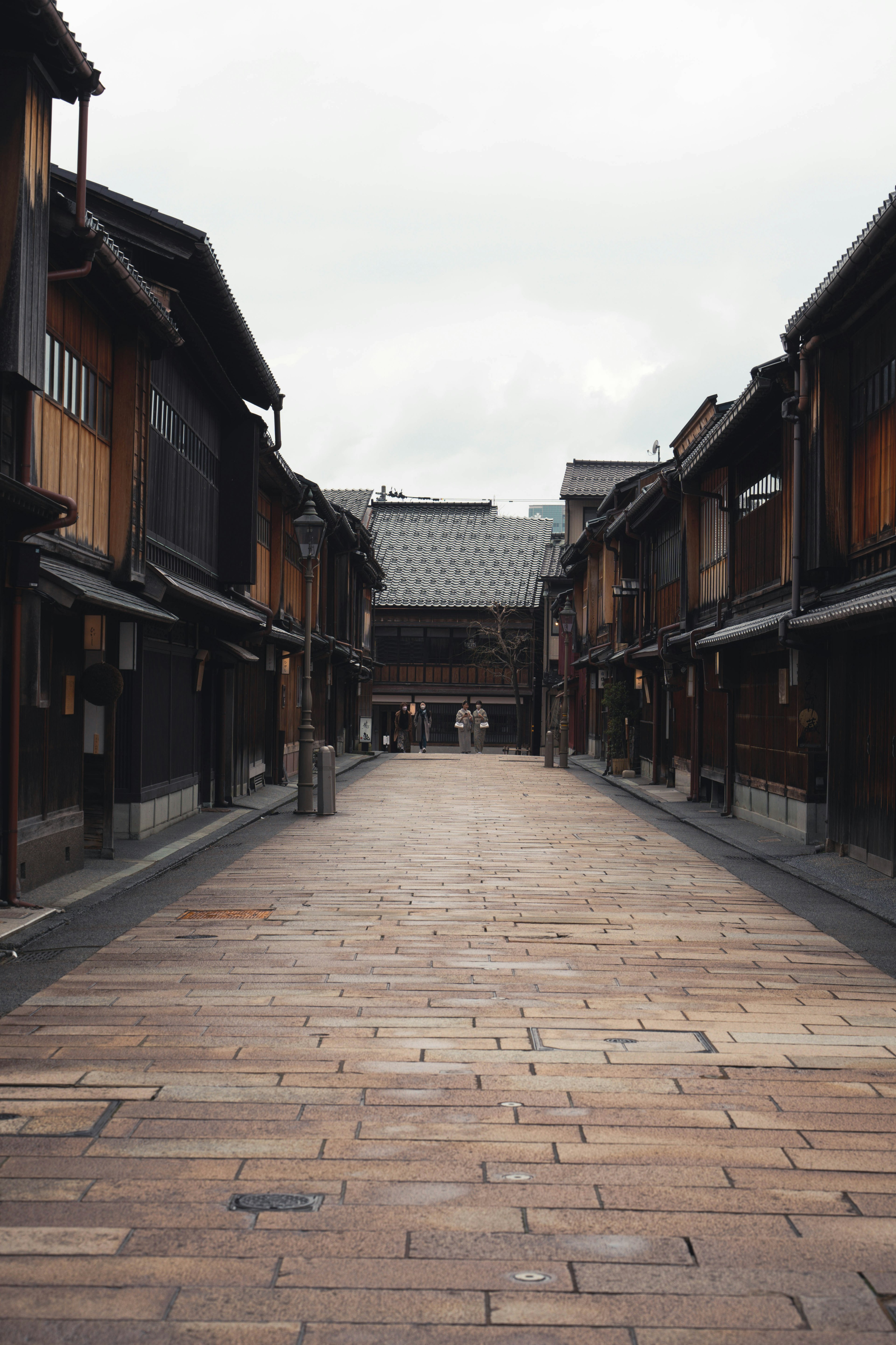 Quiet street lined with traditional wooden buildings