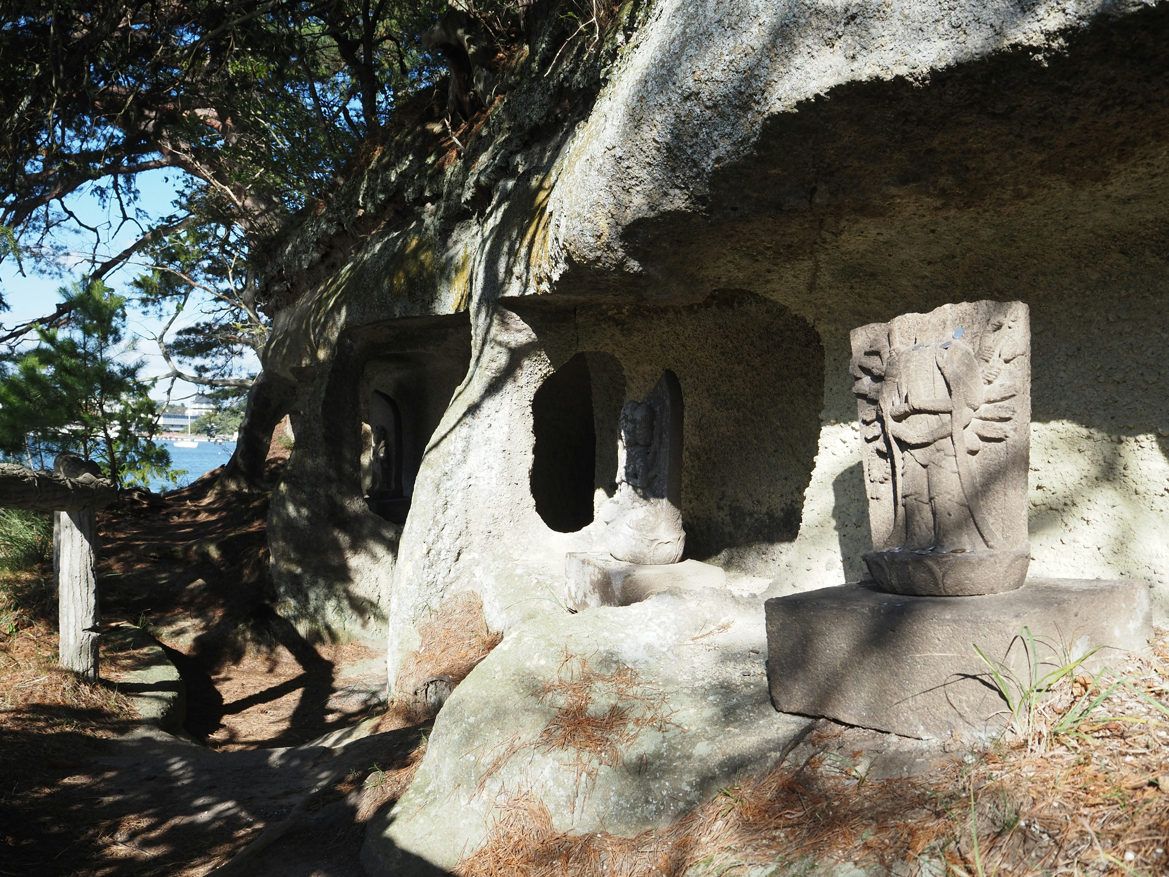 A rocky area featuring ancient carvings and natural scenery