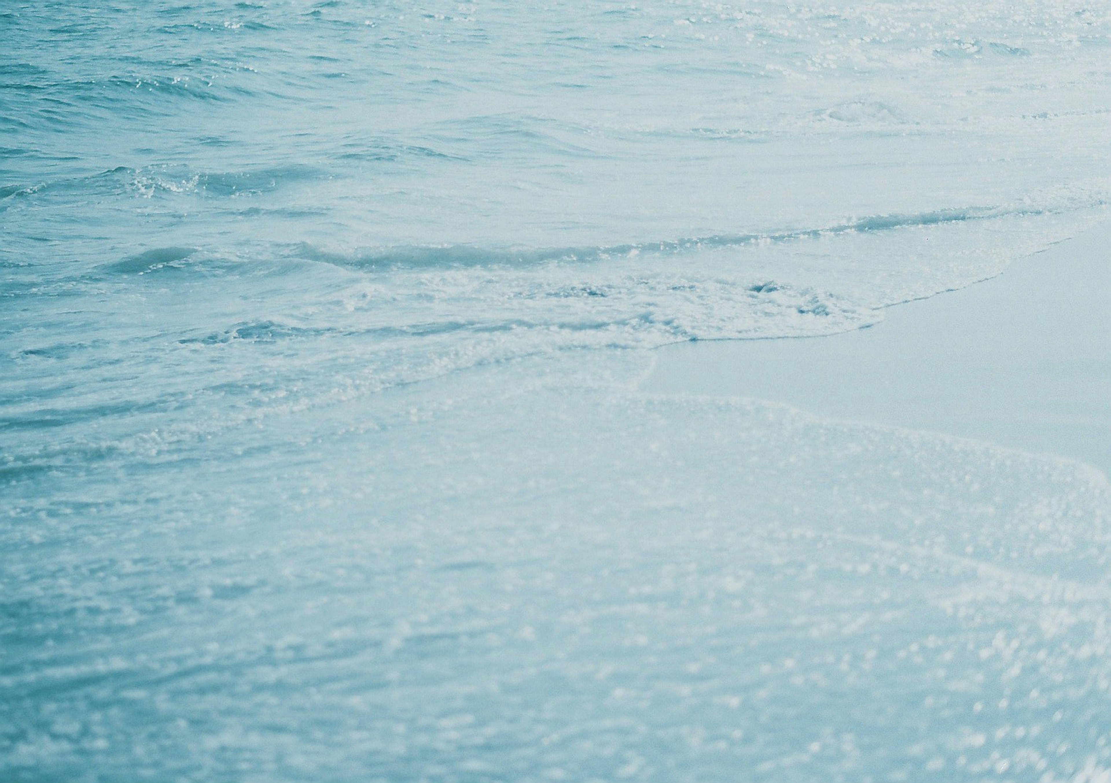 Calm blue sea surface with visible waves