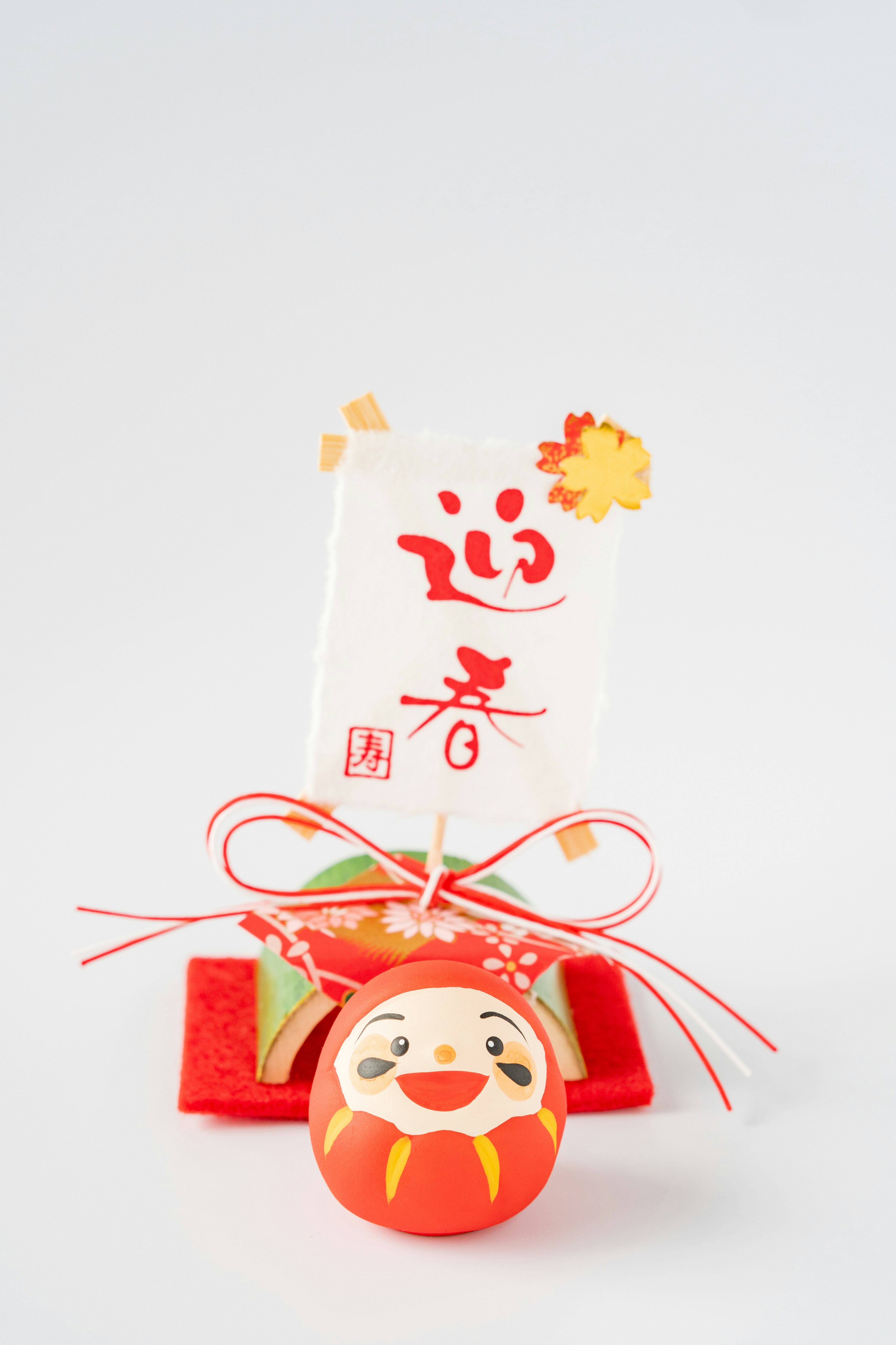 Traditional Japanese decorative item with red colors and calligraphy