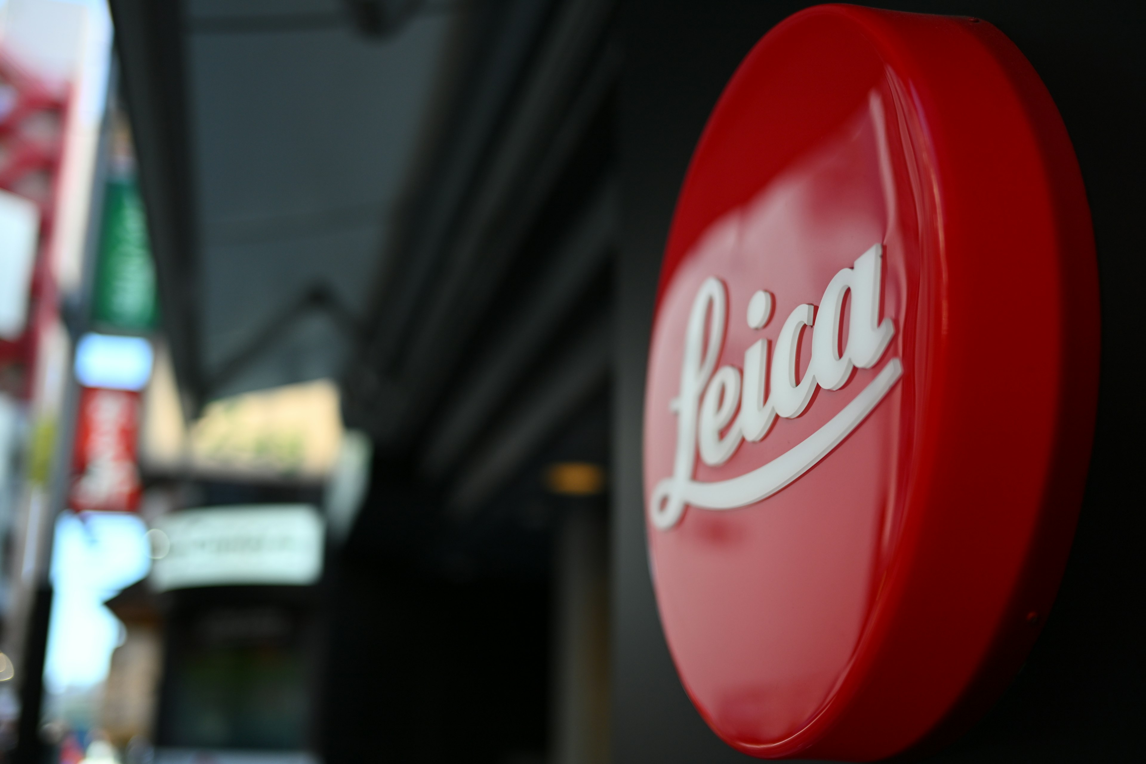 Prominent red Leica logo on a storefront