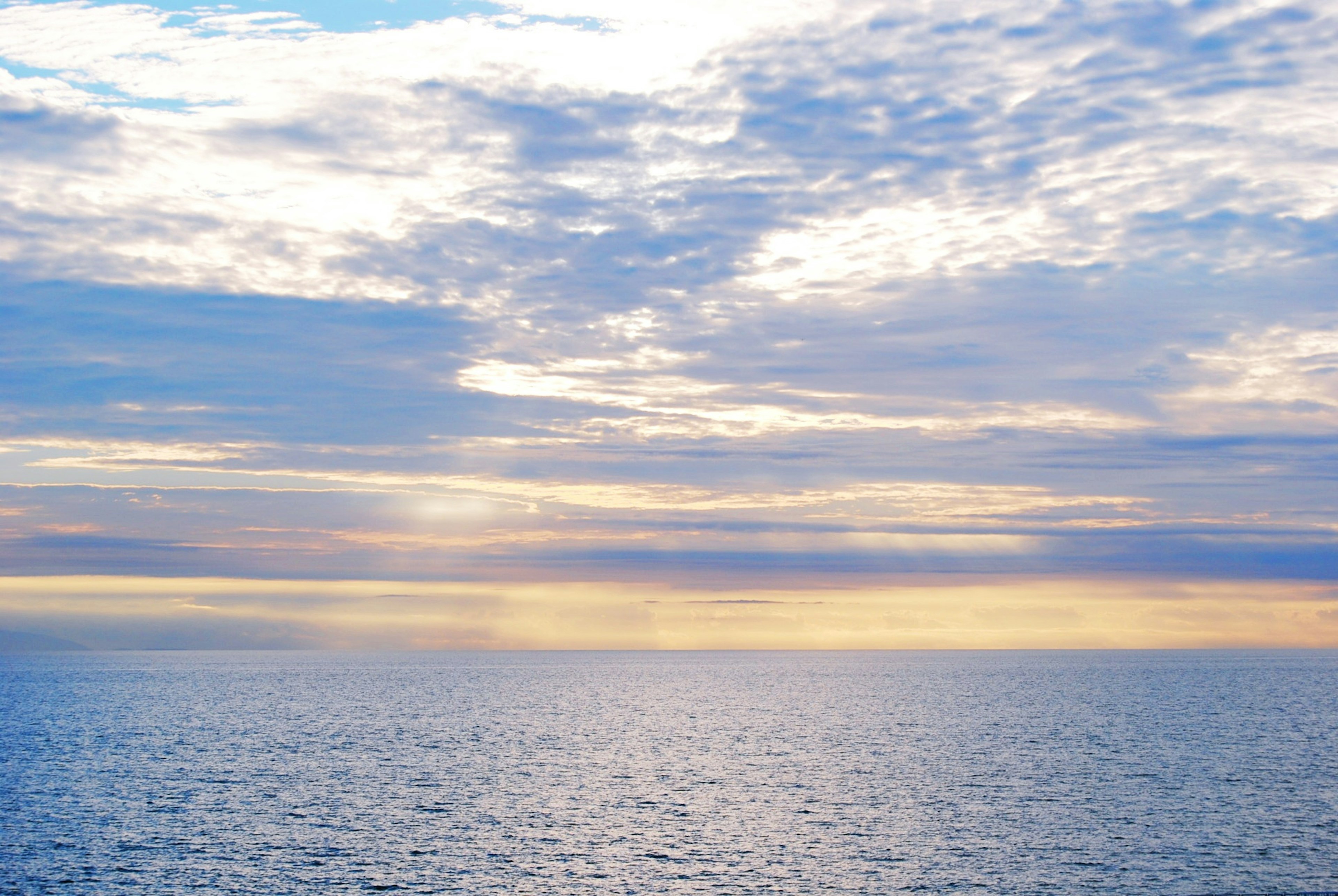 A beautiful view of a blue ocean and sky