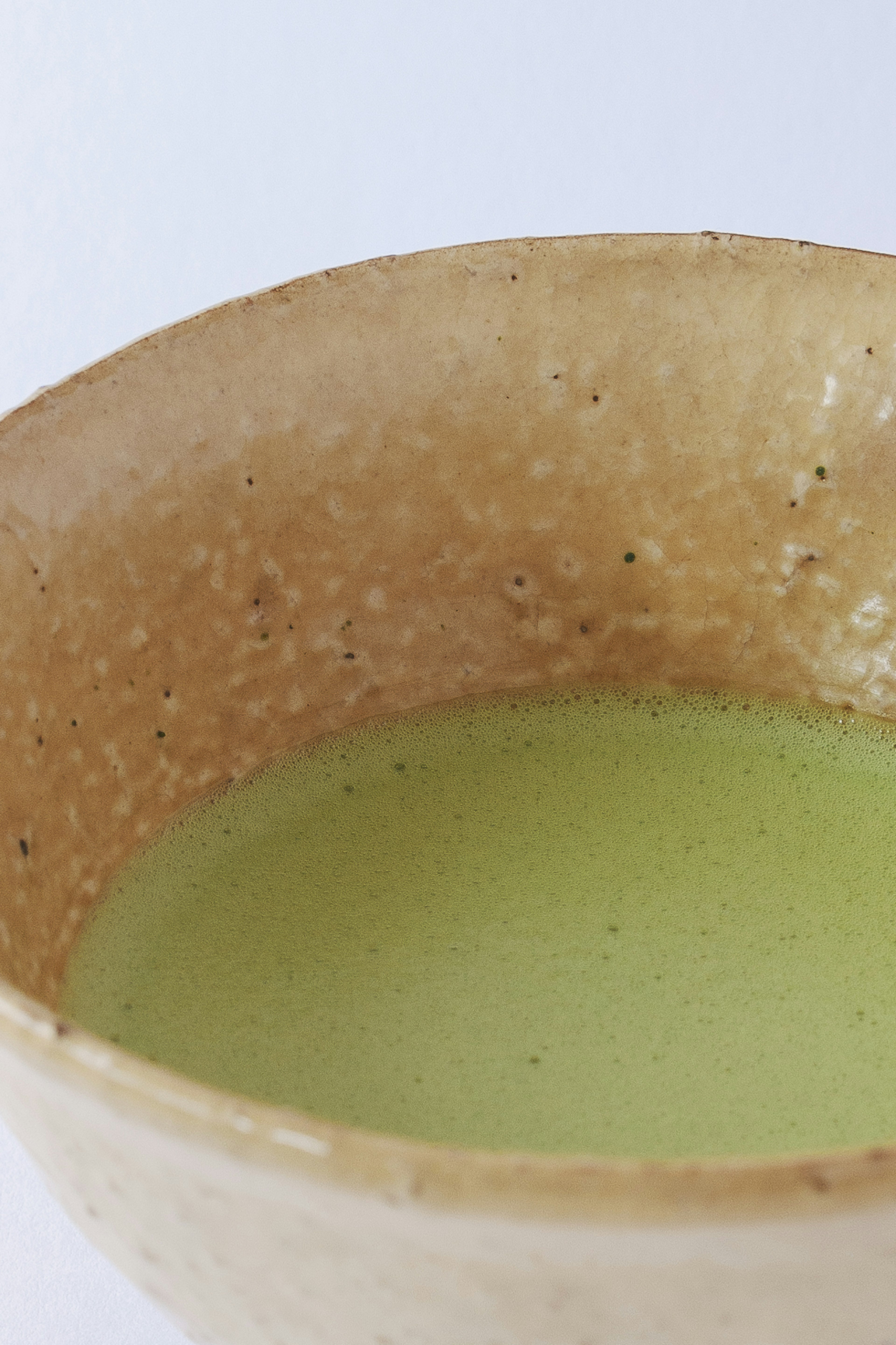 Close-up of a bowl filled with green tea