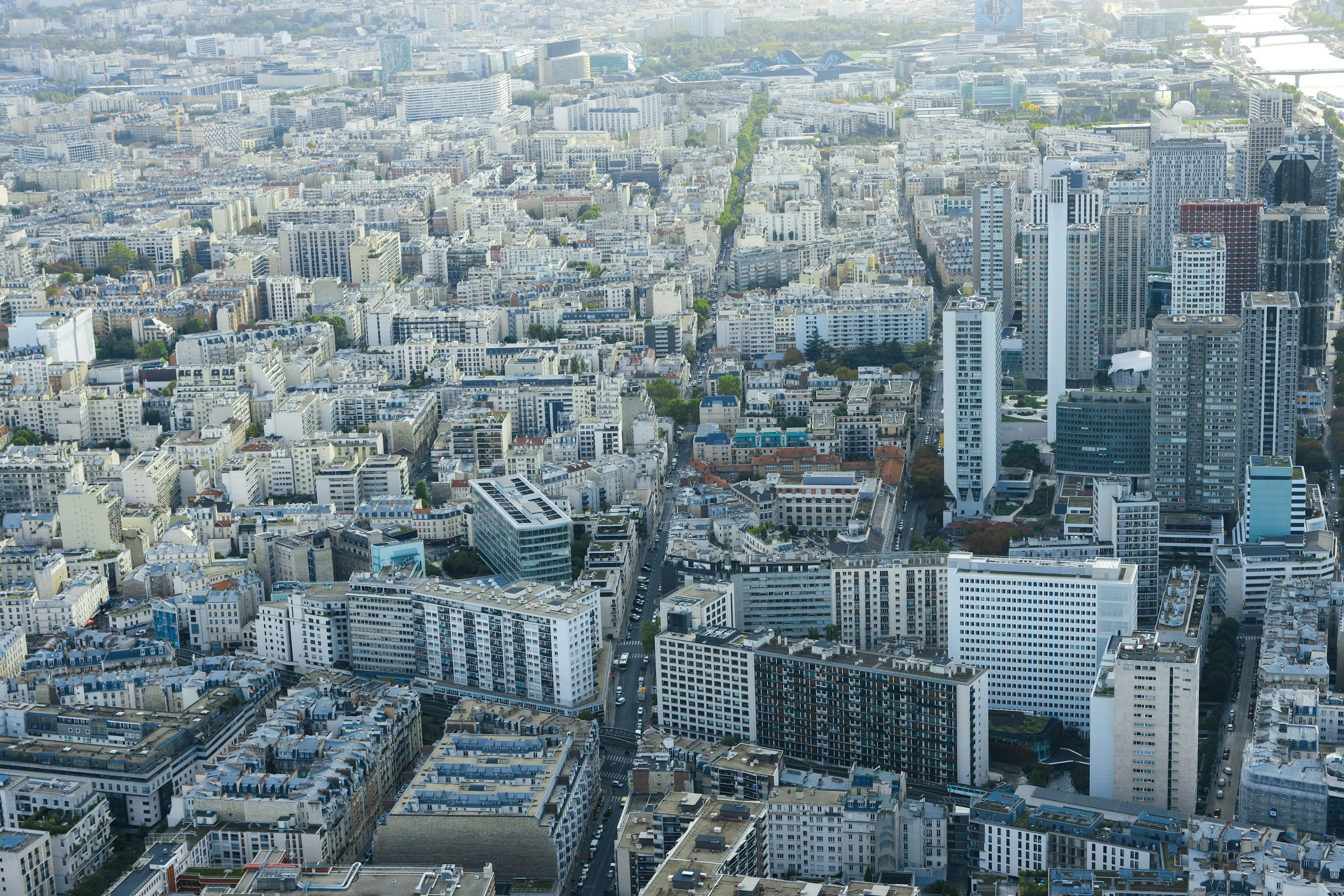 Aerial view of Paris showcasing urban landscape with high-rise buildings and streets