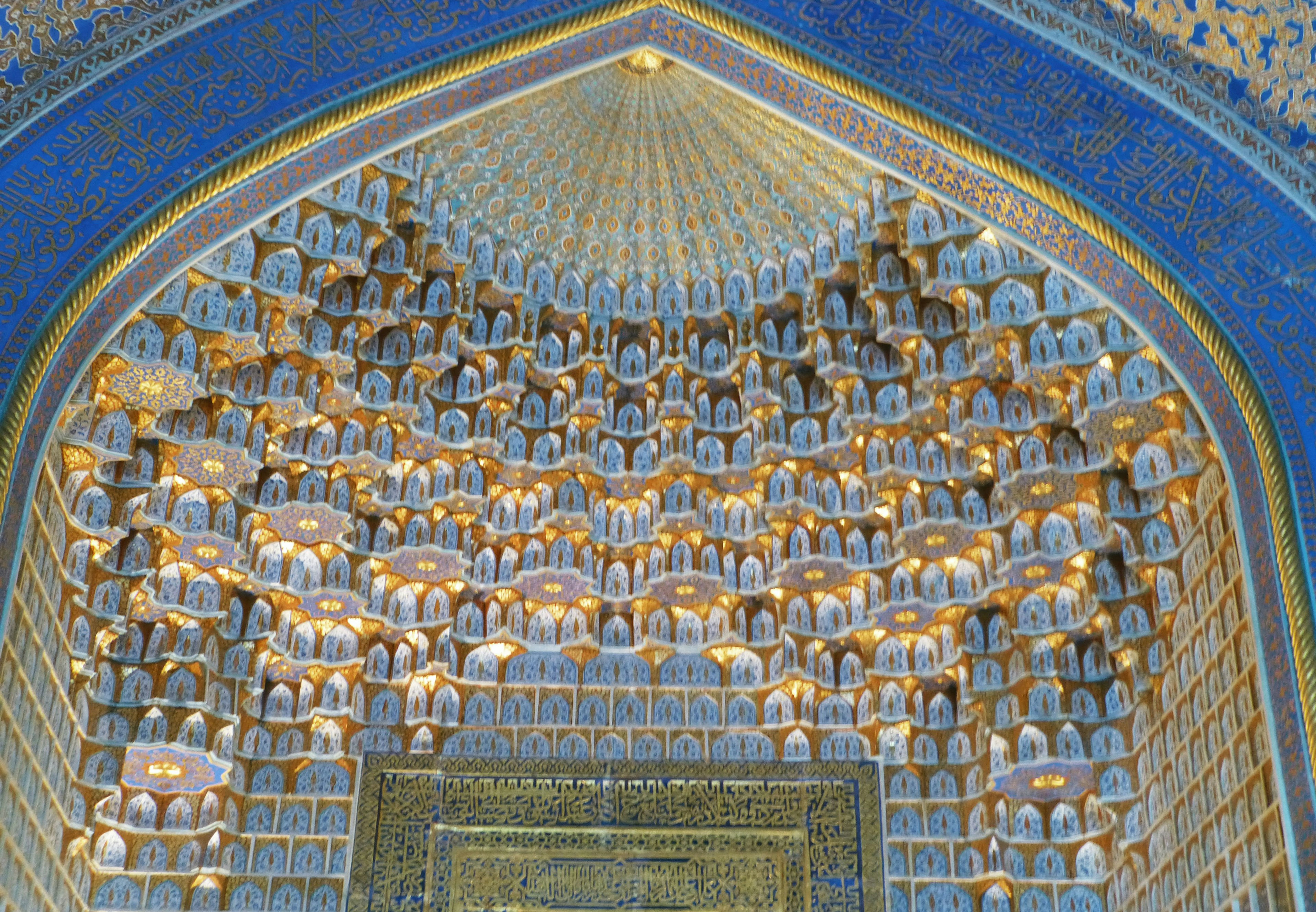 Intricate ceiling design featuring blue tiles and golden decorations