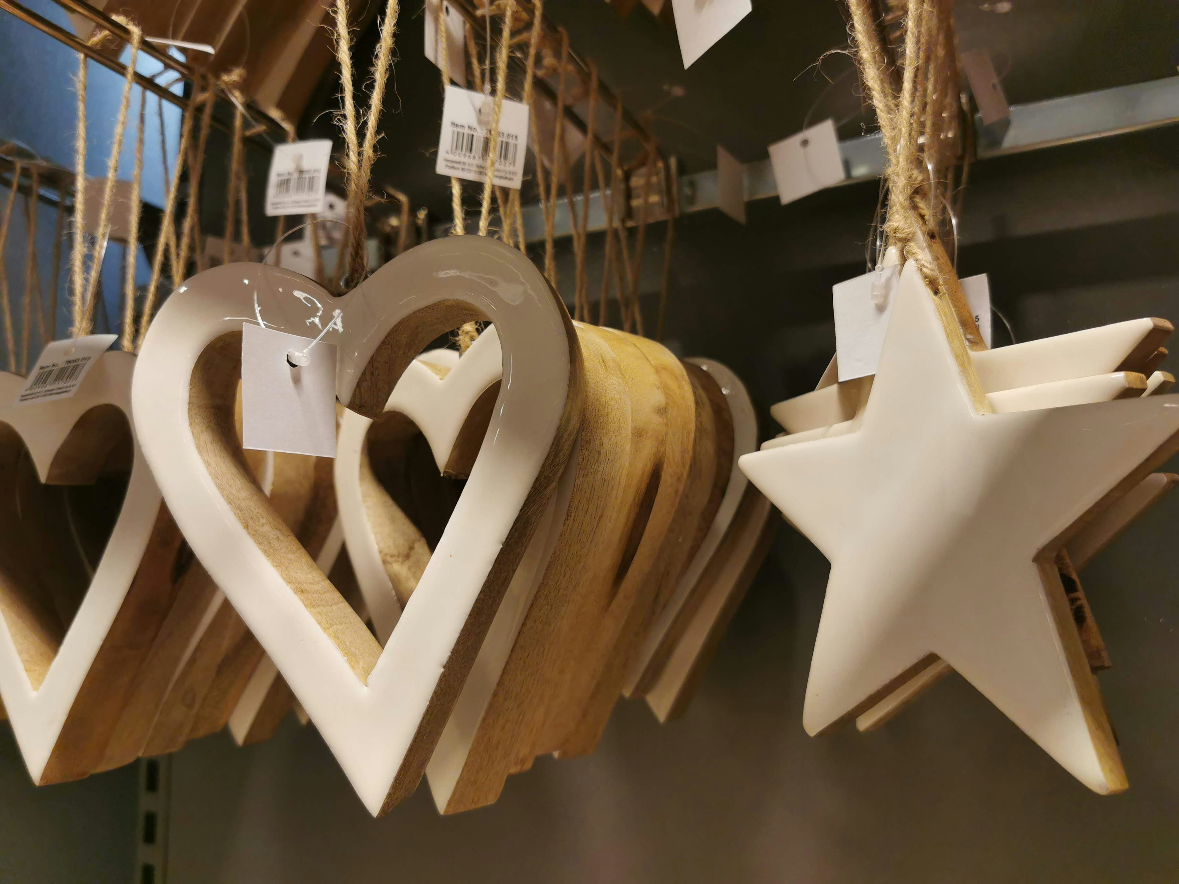 Hanging white wooden heart and star decorations