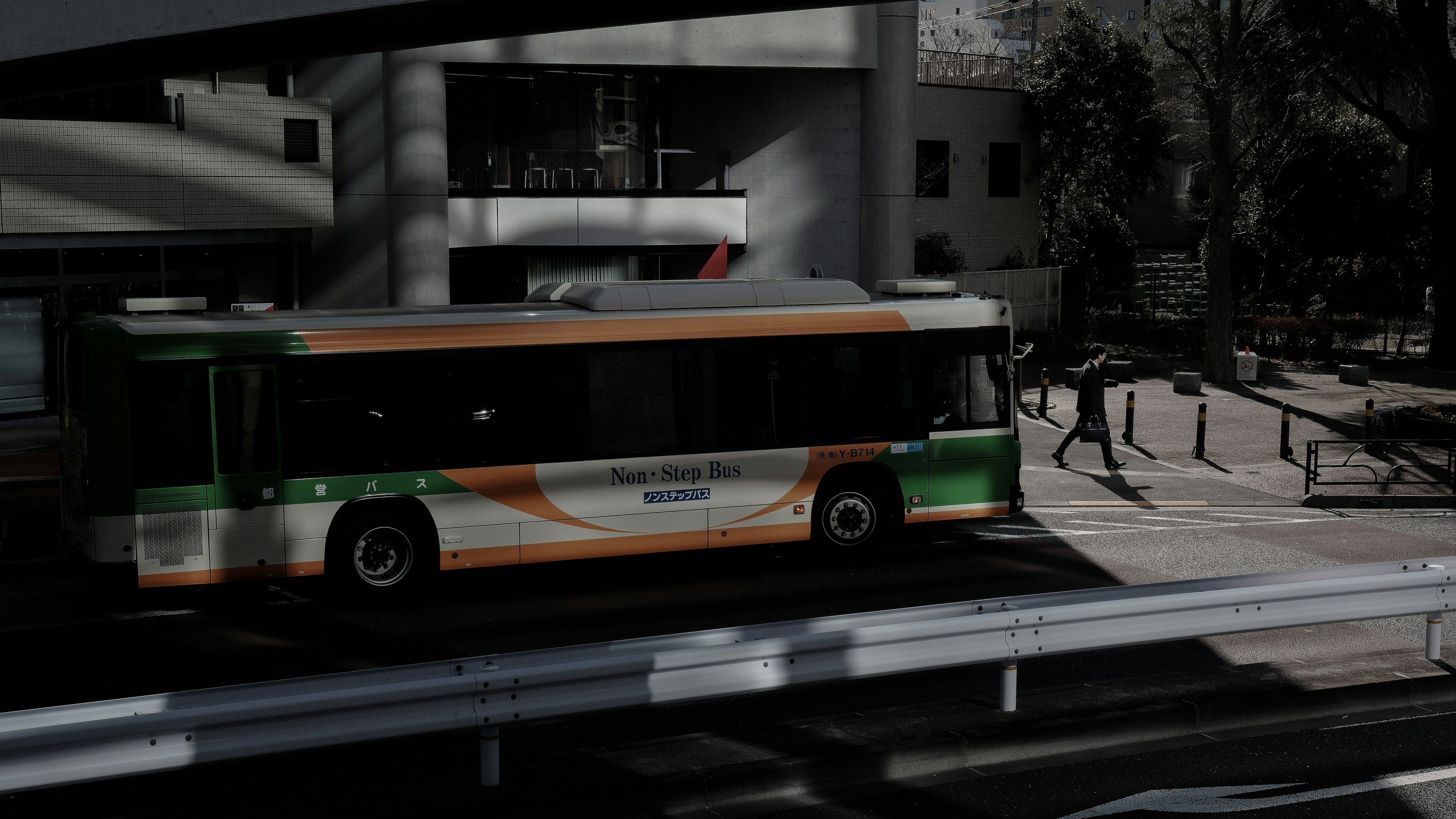 City scene with a bus at a stop