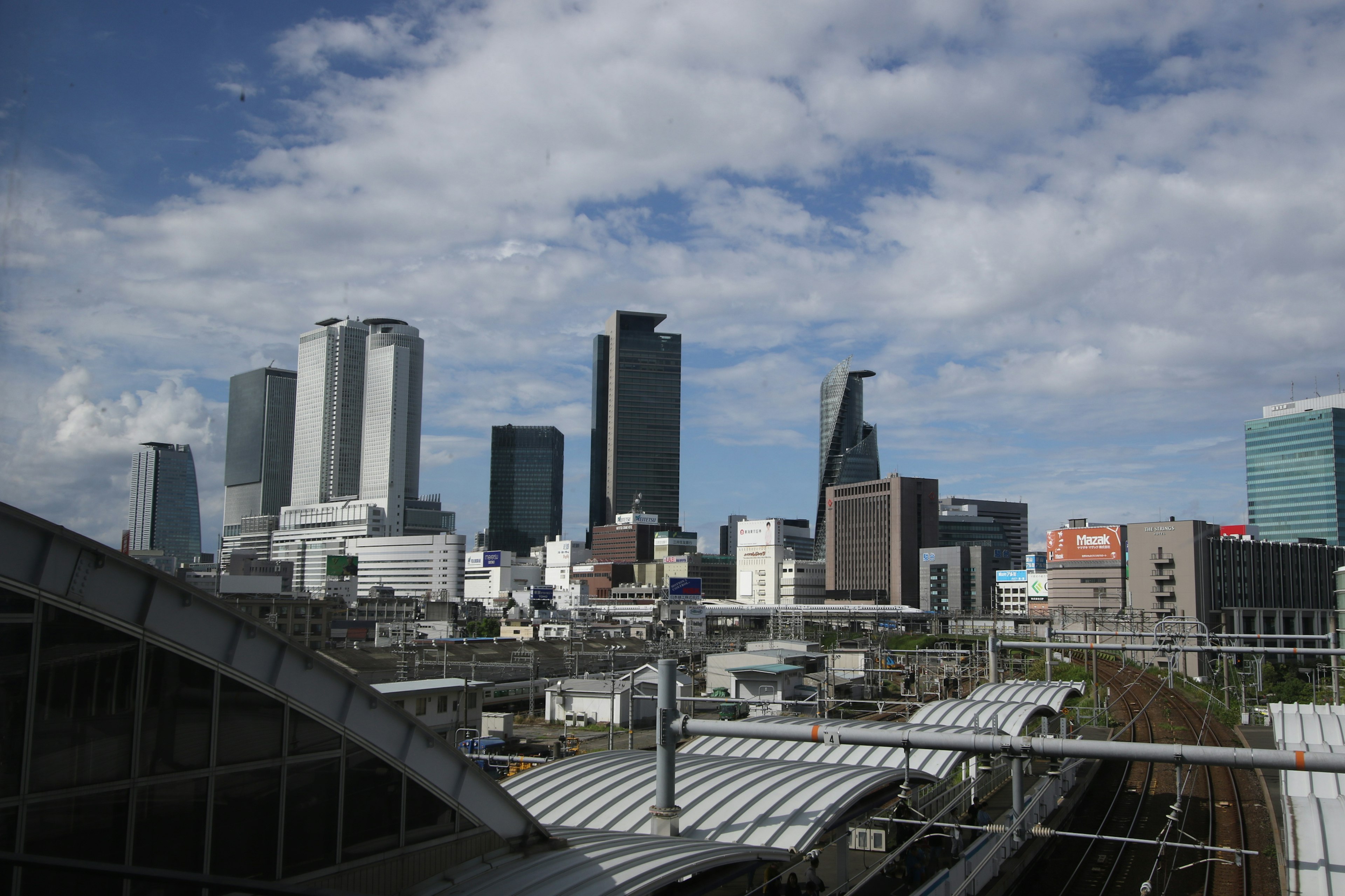 View of a city skyline with modern skyscrapers and a blue sky