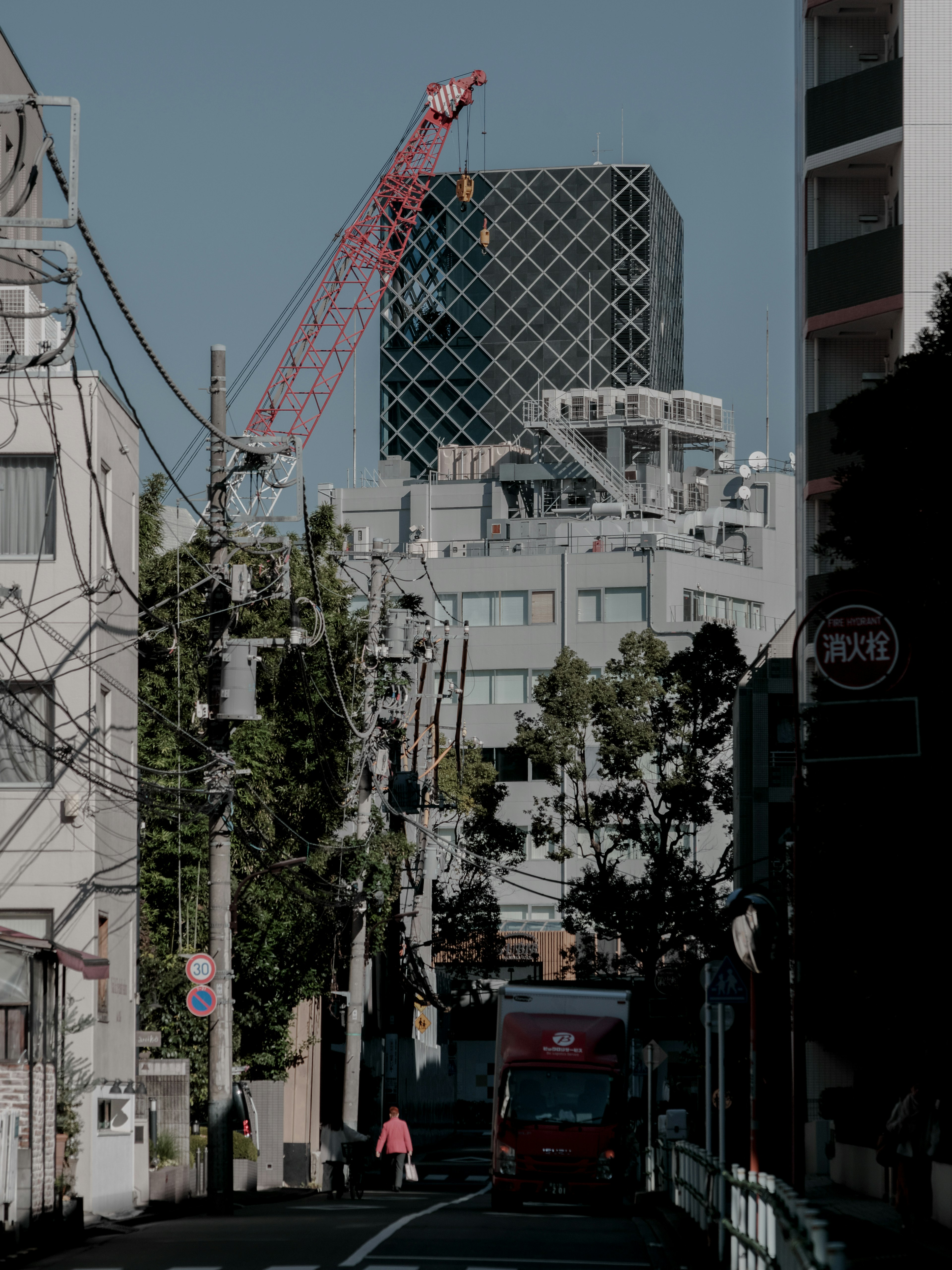 Cityscape featuring a crane and modern buildings