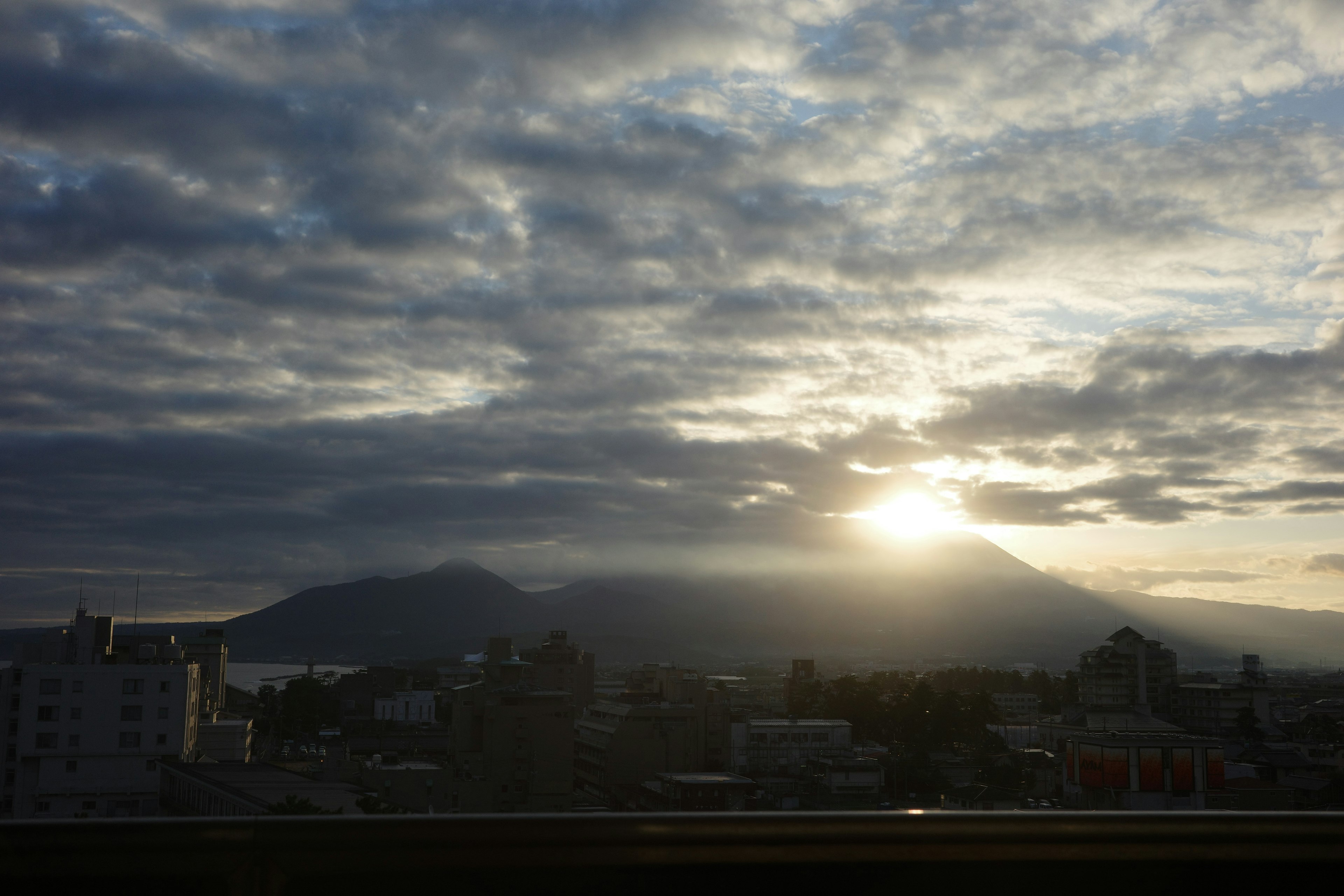 Beautiful landscape with sunset rising between mountains