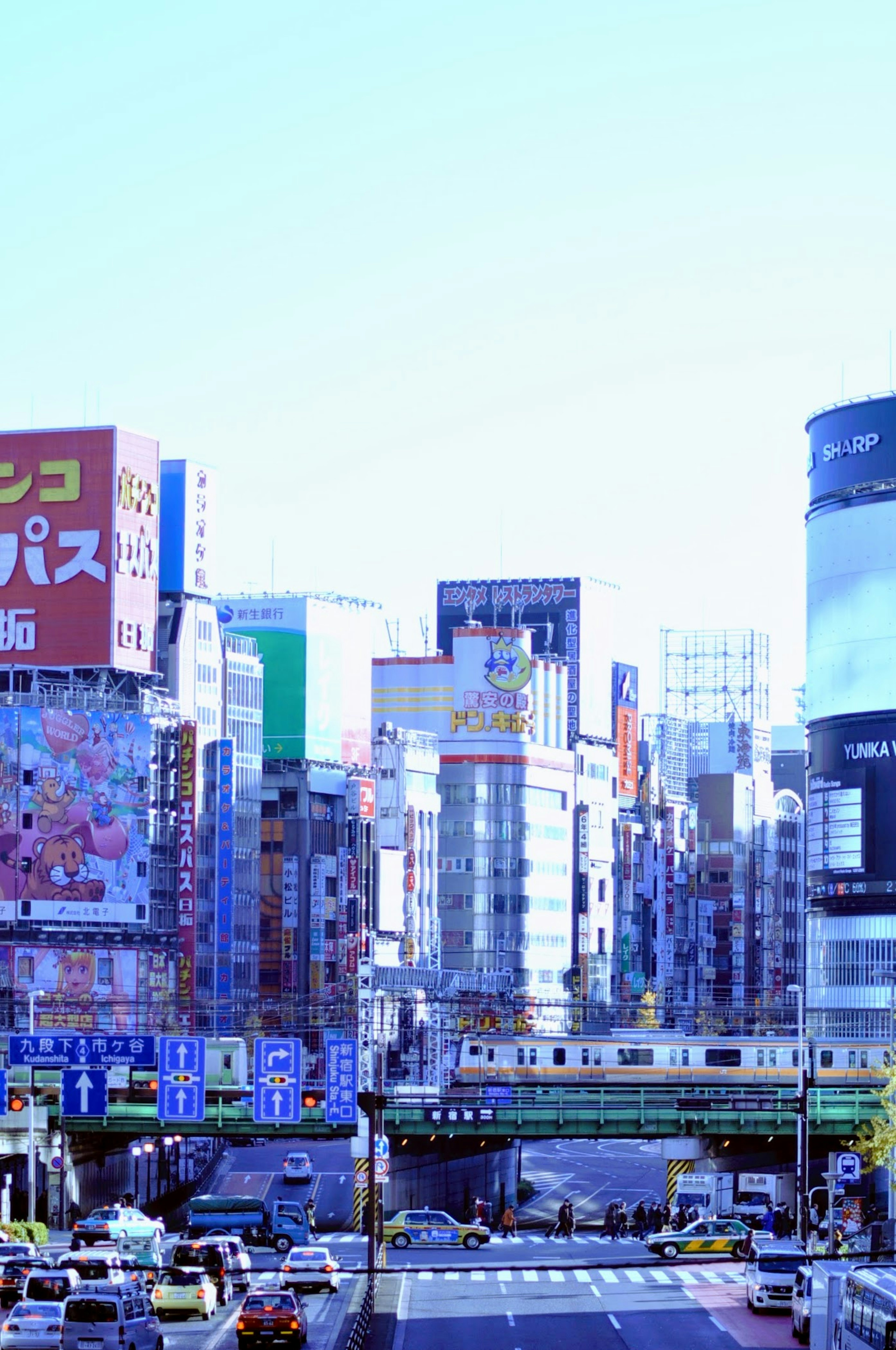 Cityscape featuring skyscrapers and colorful billboards