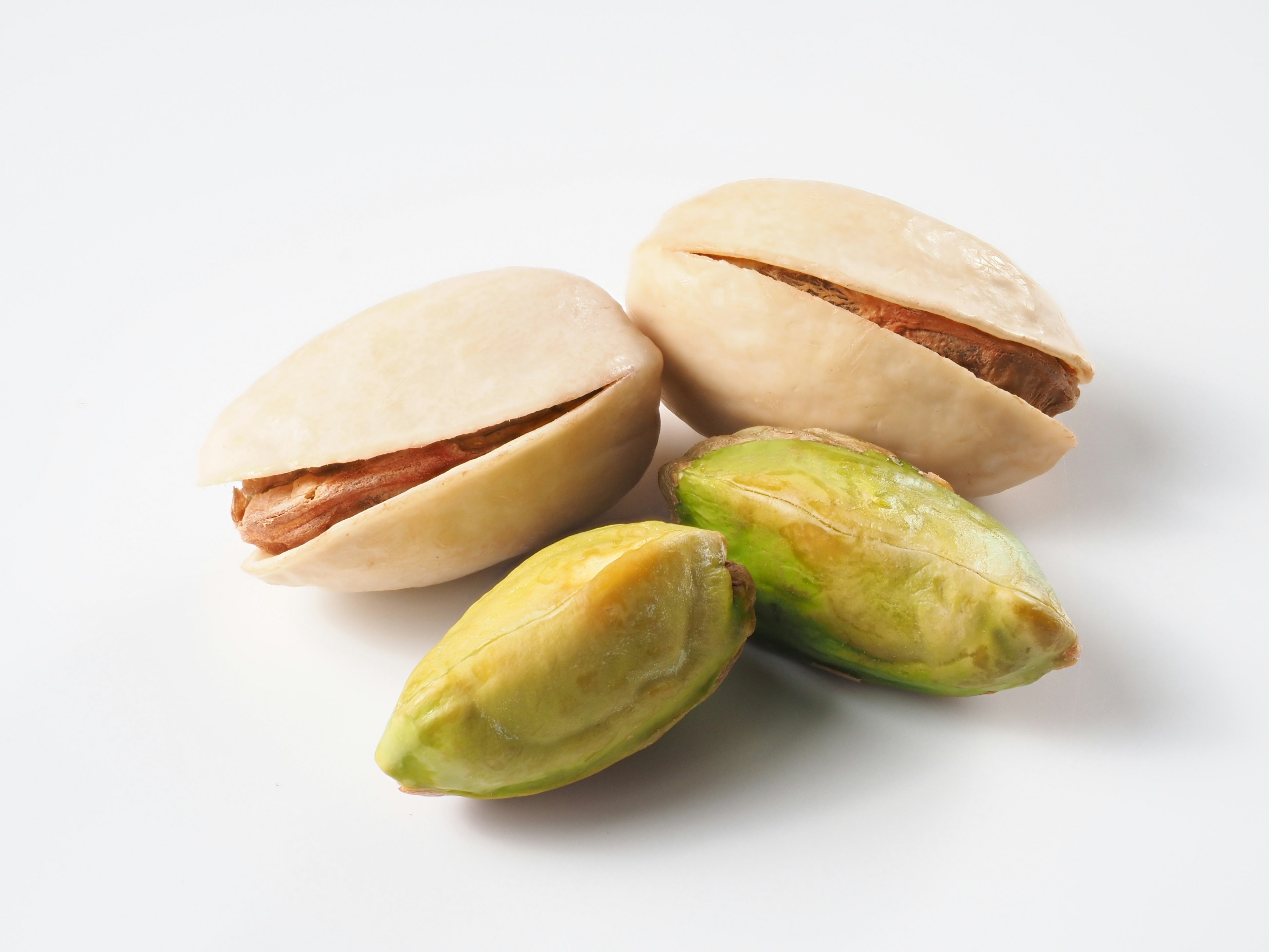 Pistachio shells and nuts arranged together