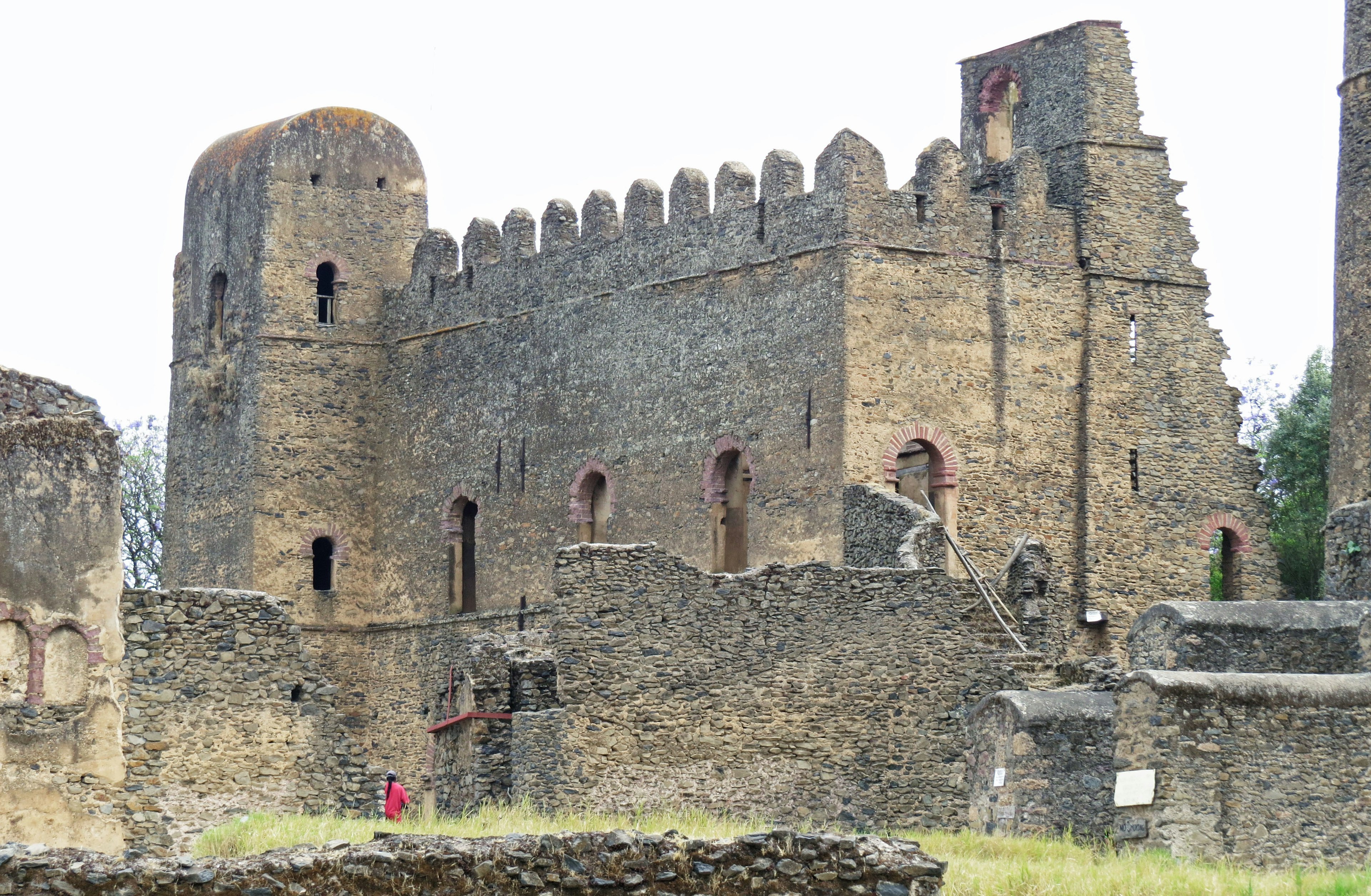 Ruins of an ancient castle in Ethiopia featuring thick stone walls and distinctive towers