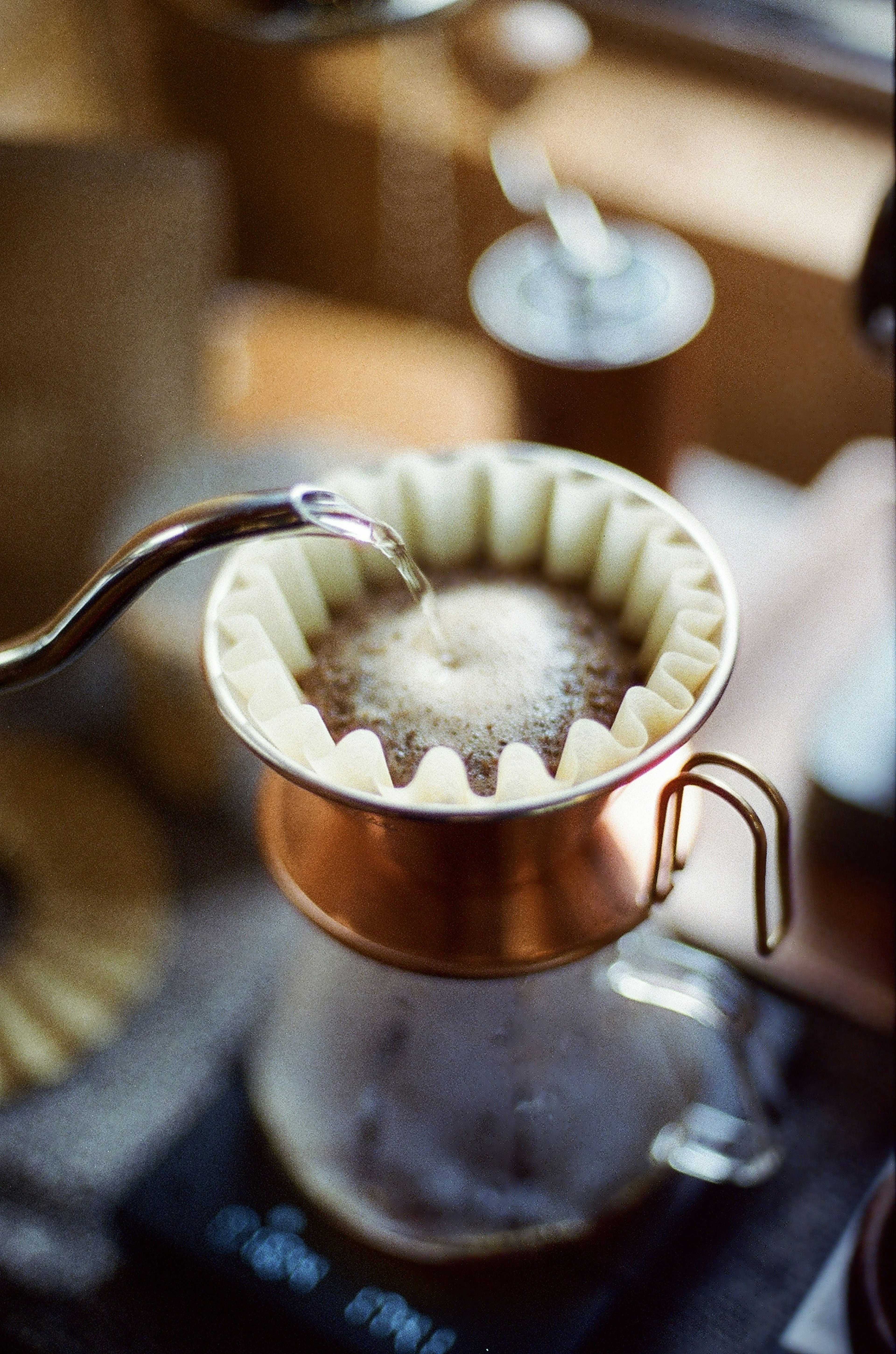 Coffee brewing equipment with a filter and pouring spout