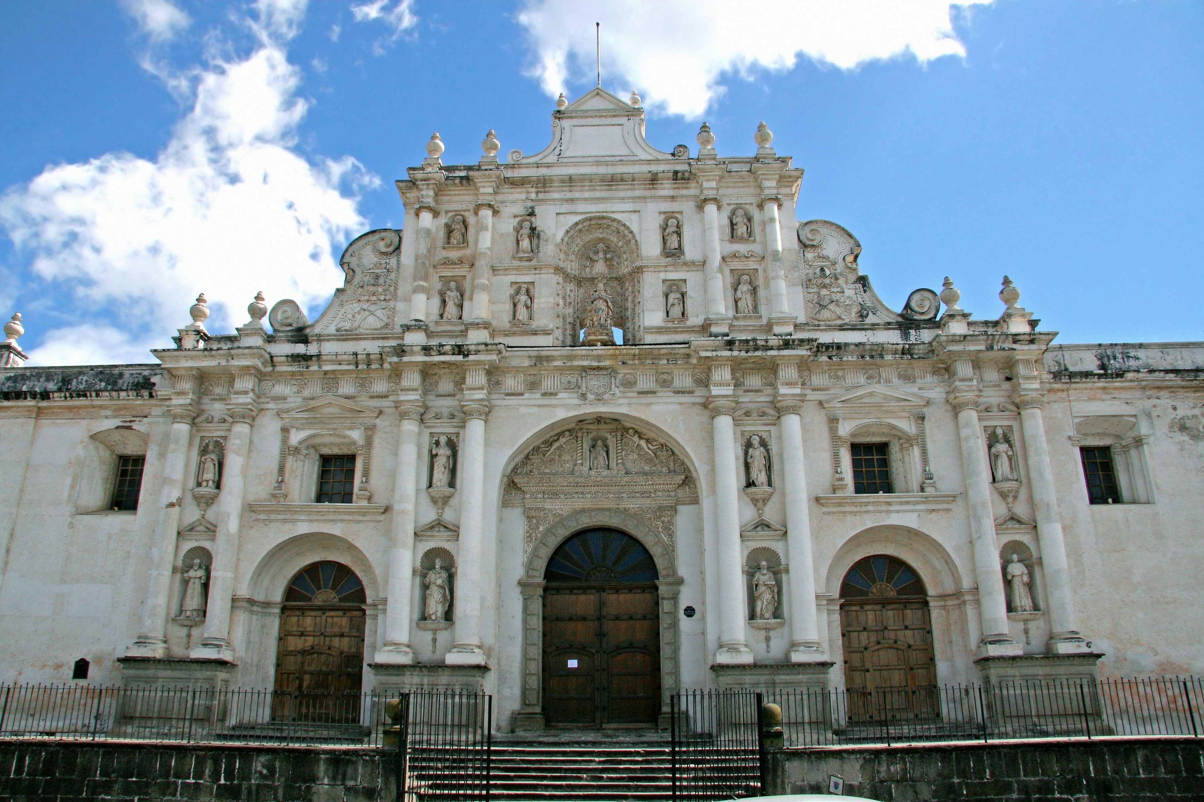 Stunning Baroque style church facade featuring intricate sculptures and statues