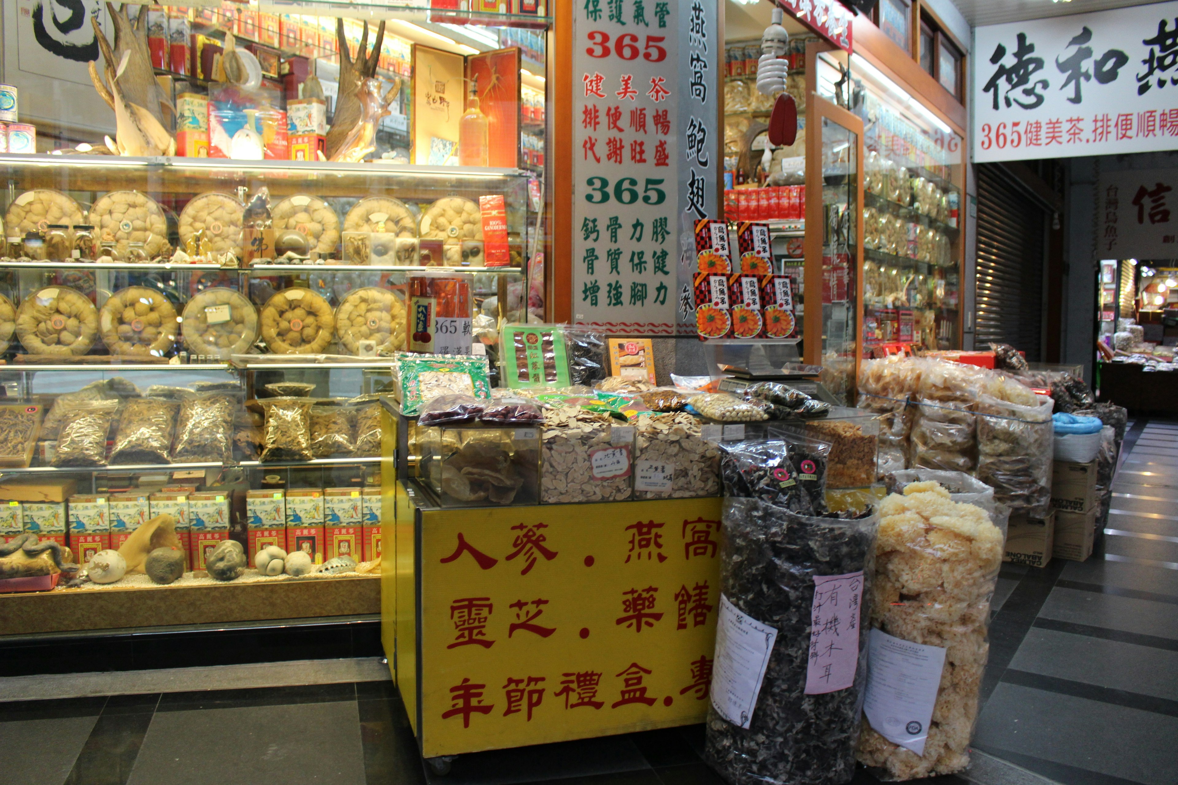 Vibrant market stall displaying various dried goods and snacks