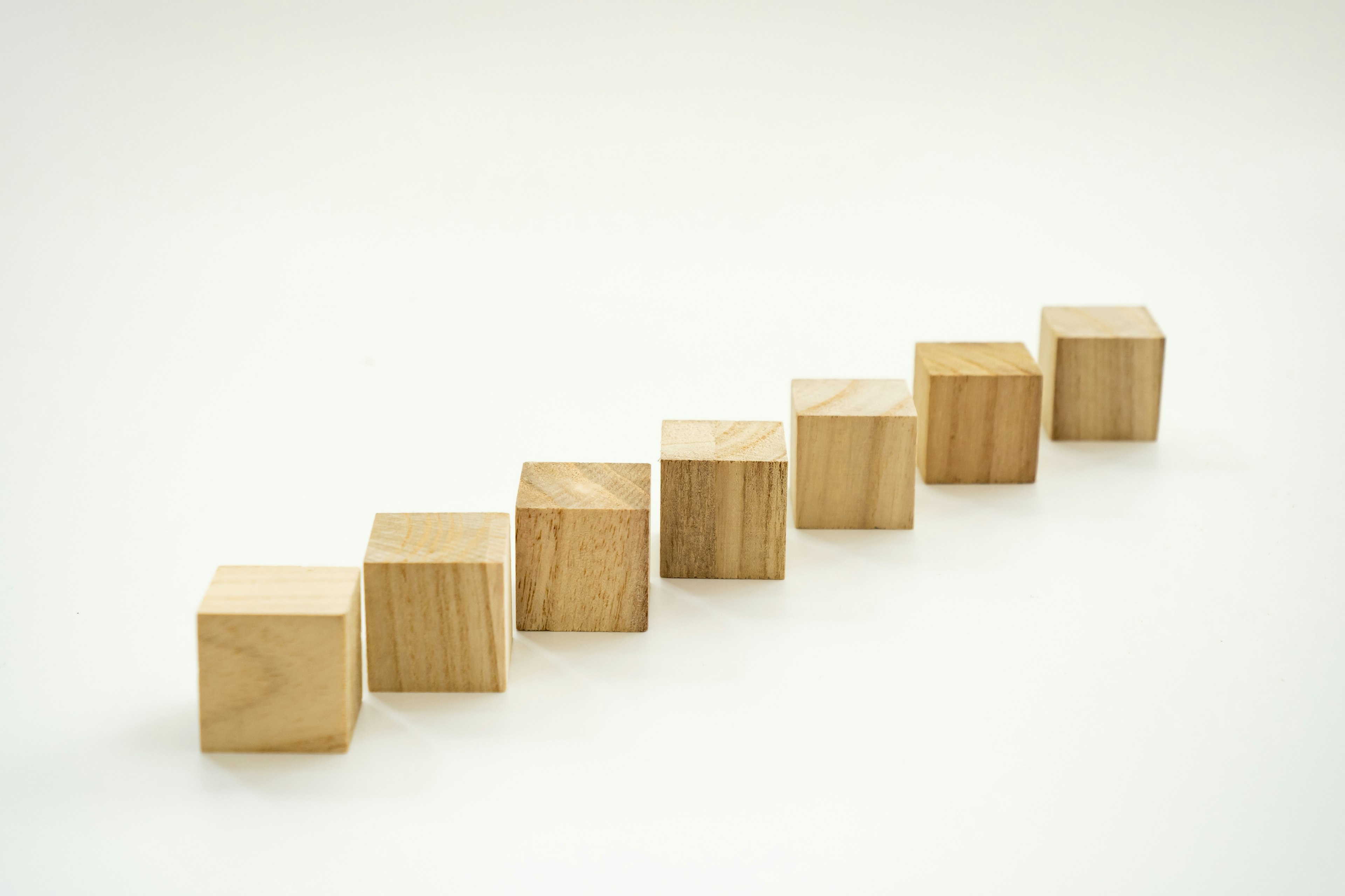 A simple image of wooden cubes arranged in a line