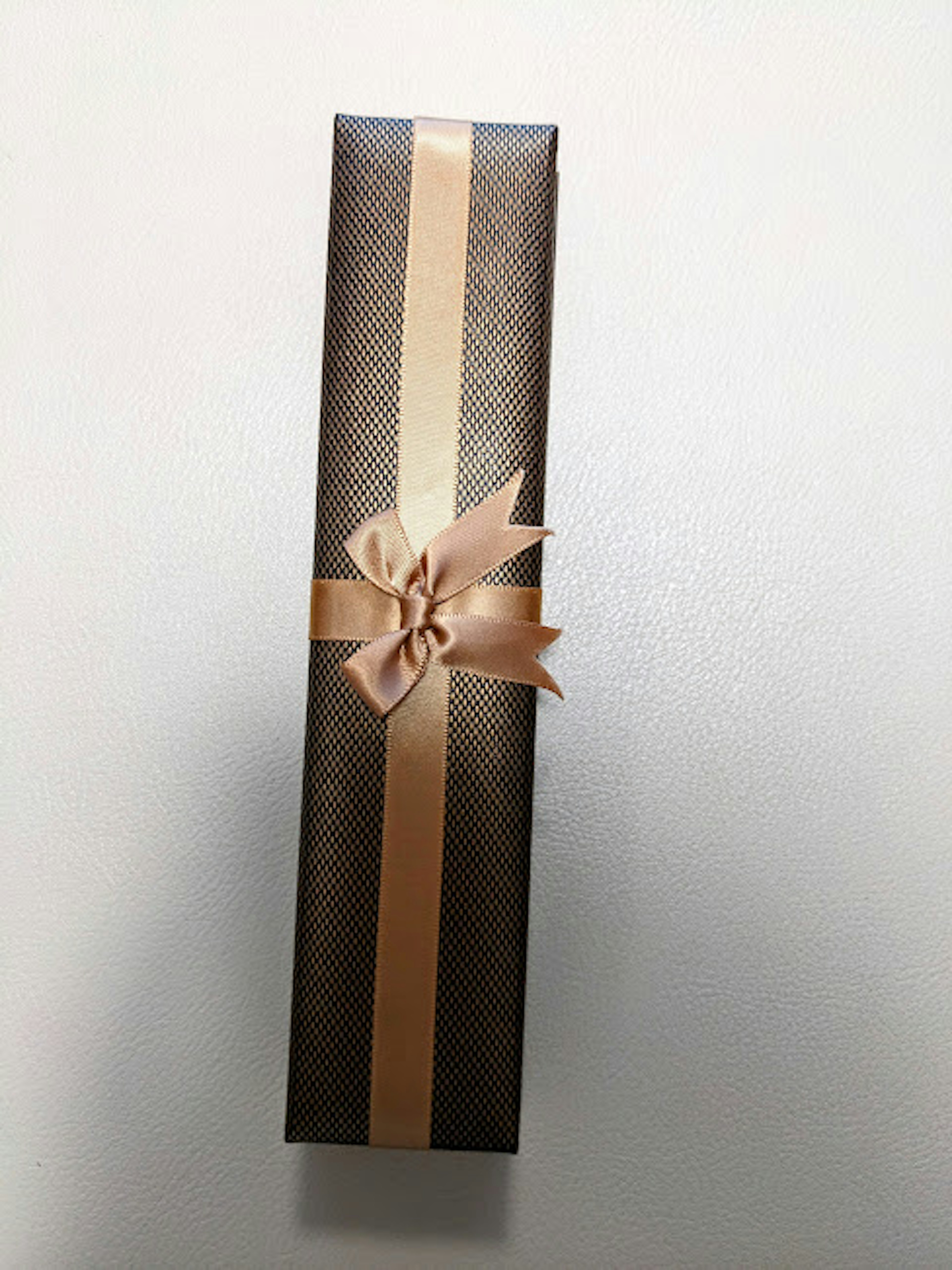 Brown gift box with a ribbon