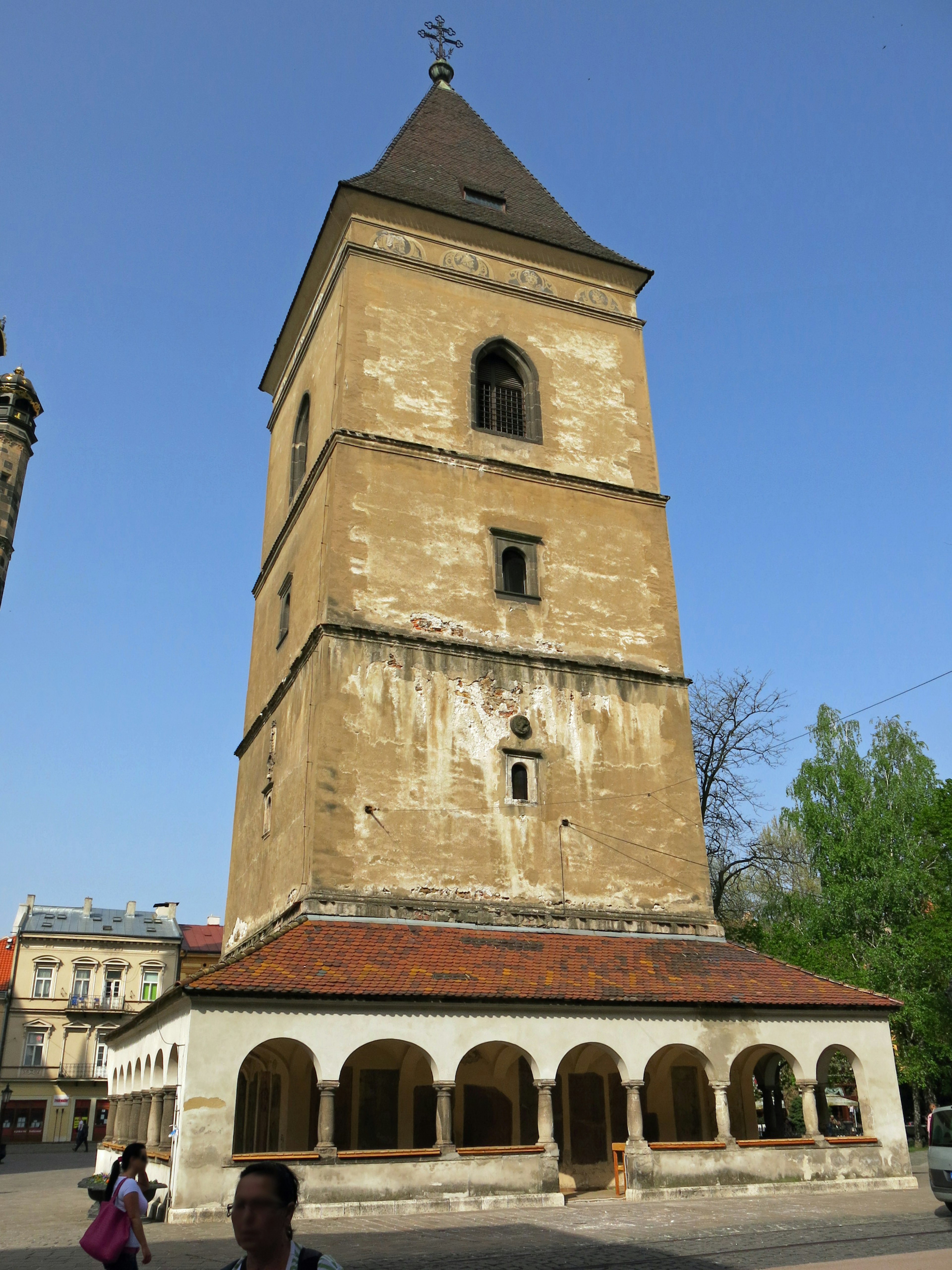 Old stone tower standing under a clear blue sky