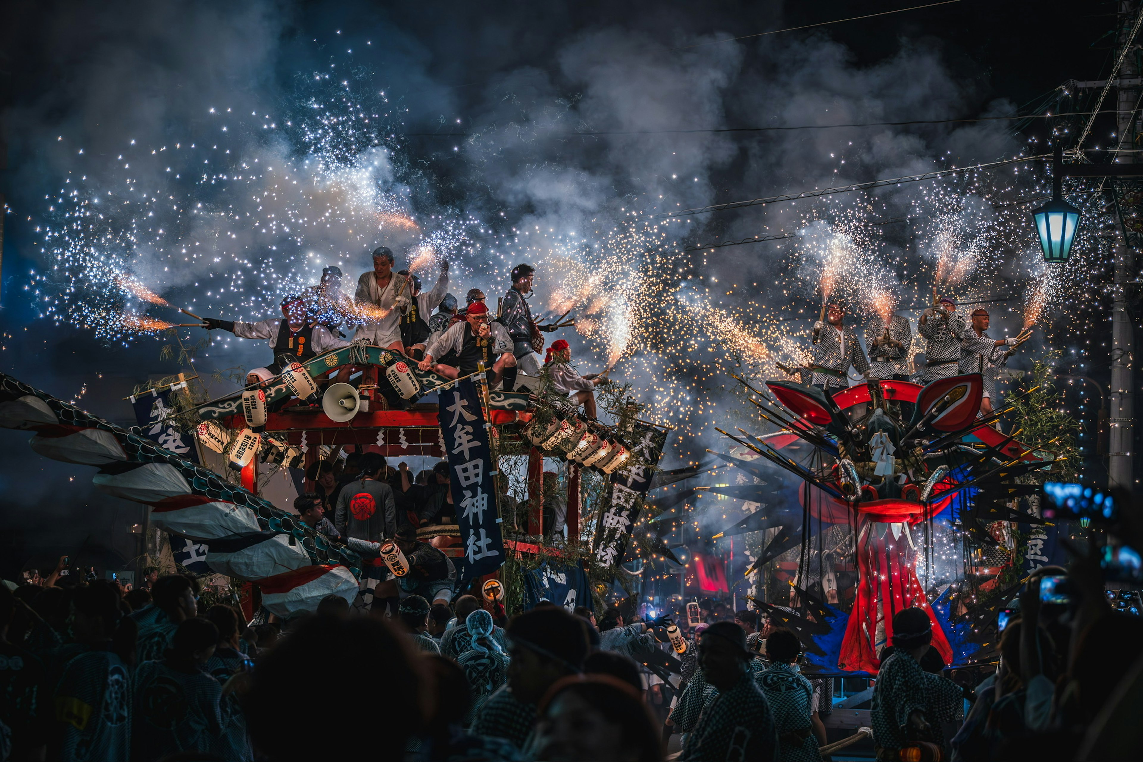 A vibrant night festival parade featuring fireworks and musical performances