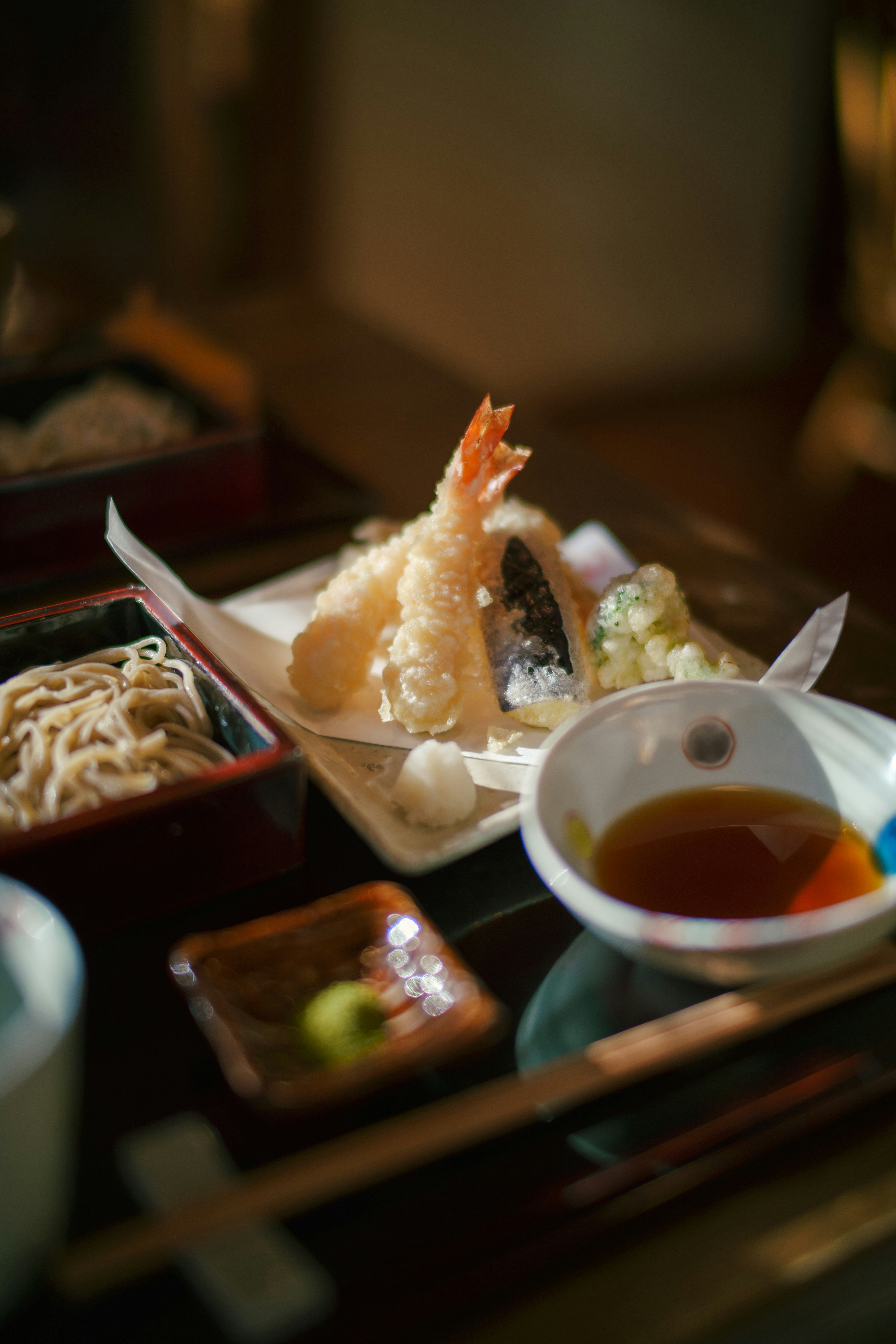 A plate of tempura and soba presented in traditional Japanese style