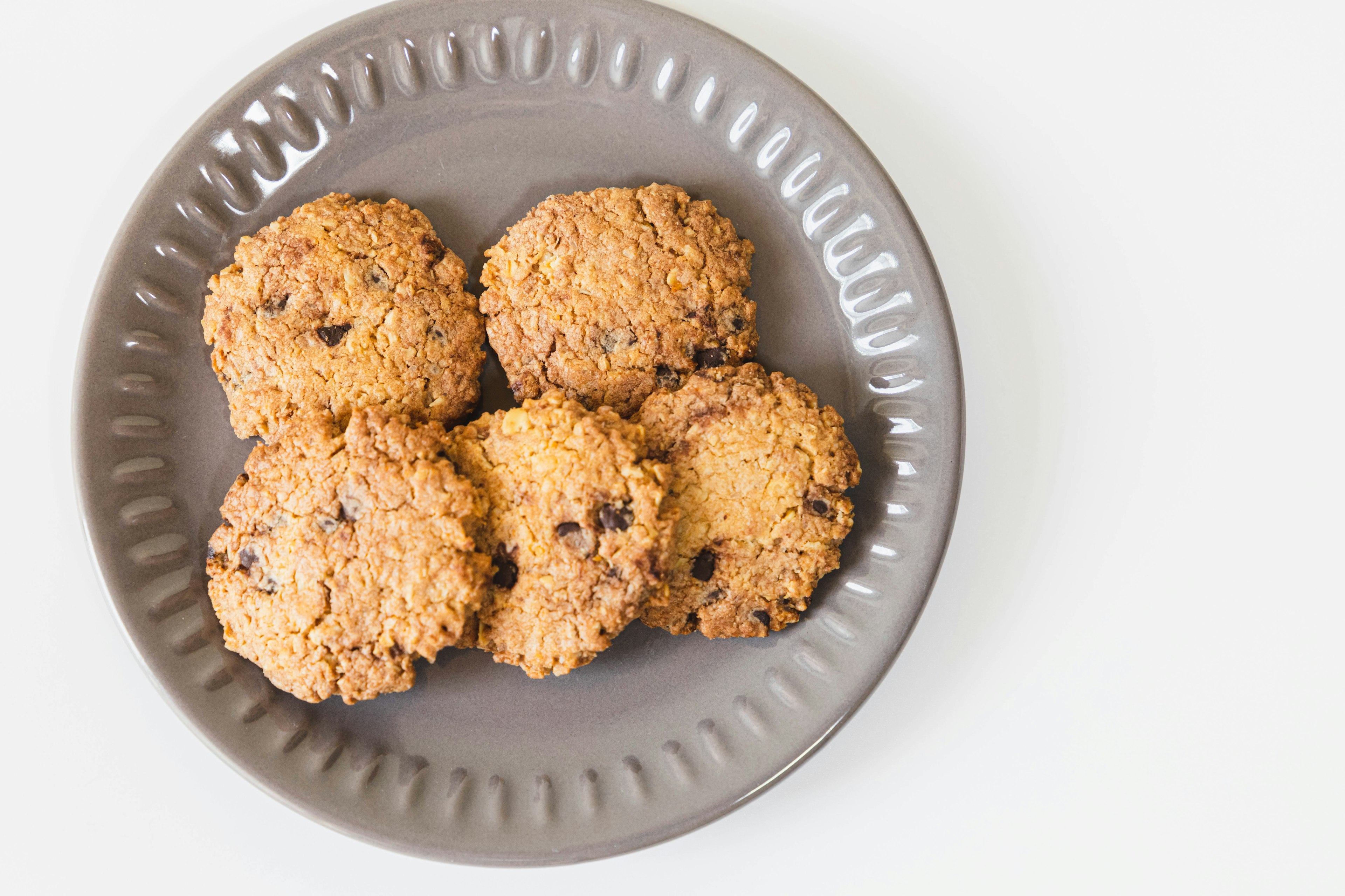 Brown cookies arranged on a gray plate