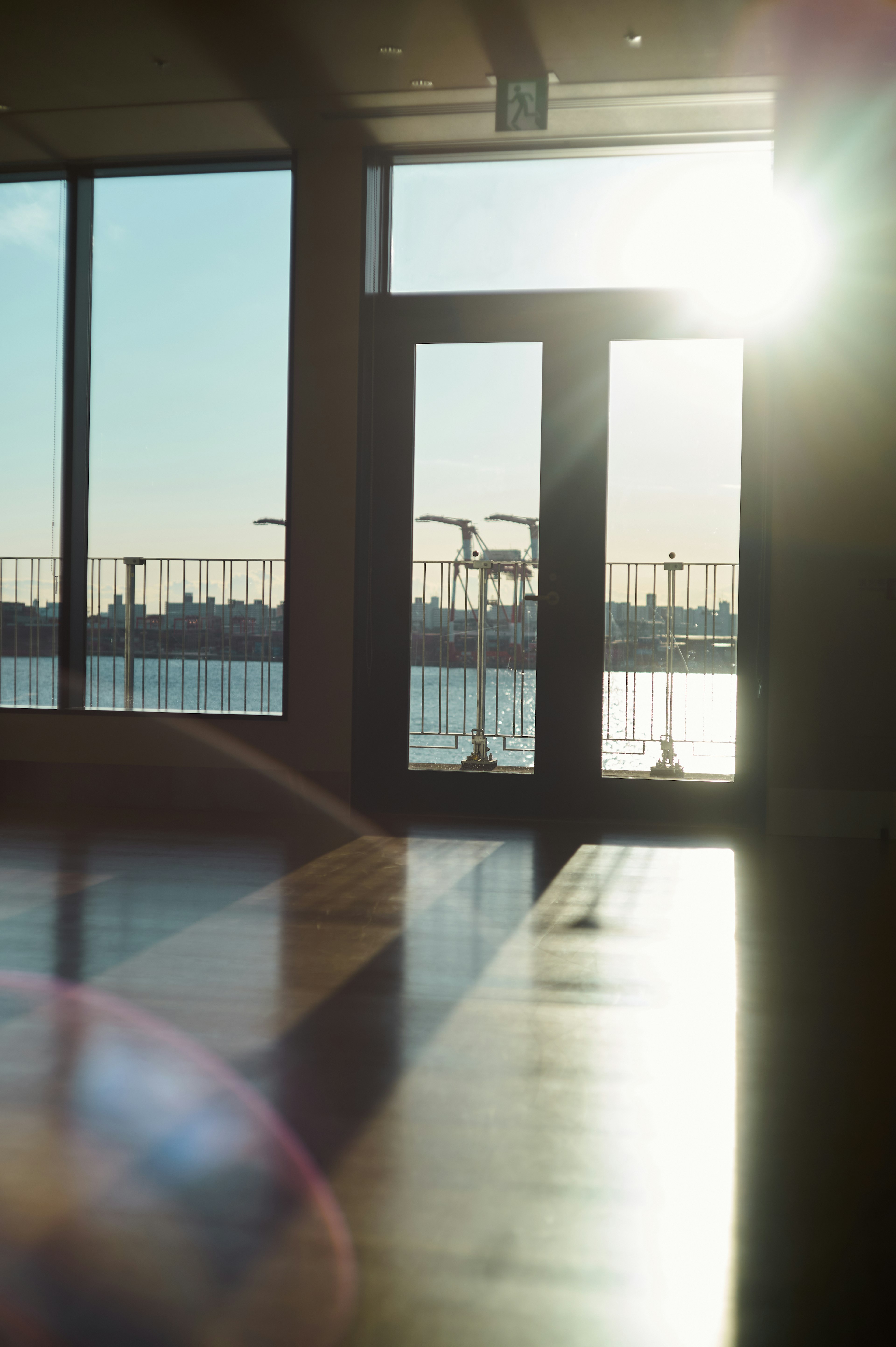 Interior view with sunlight streaming through the windows and a water surface