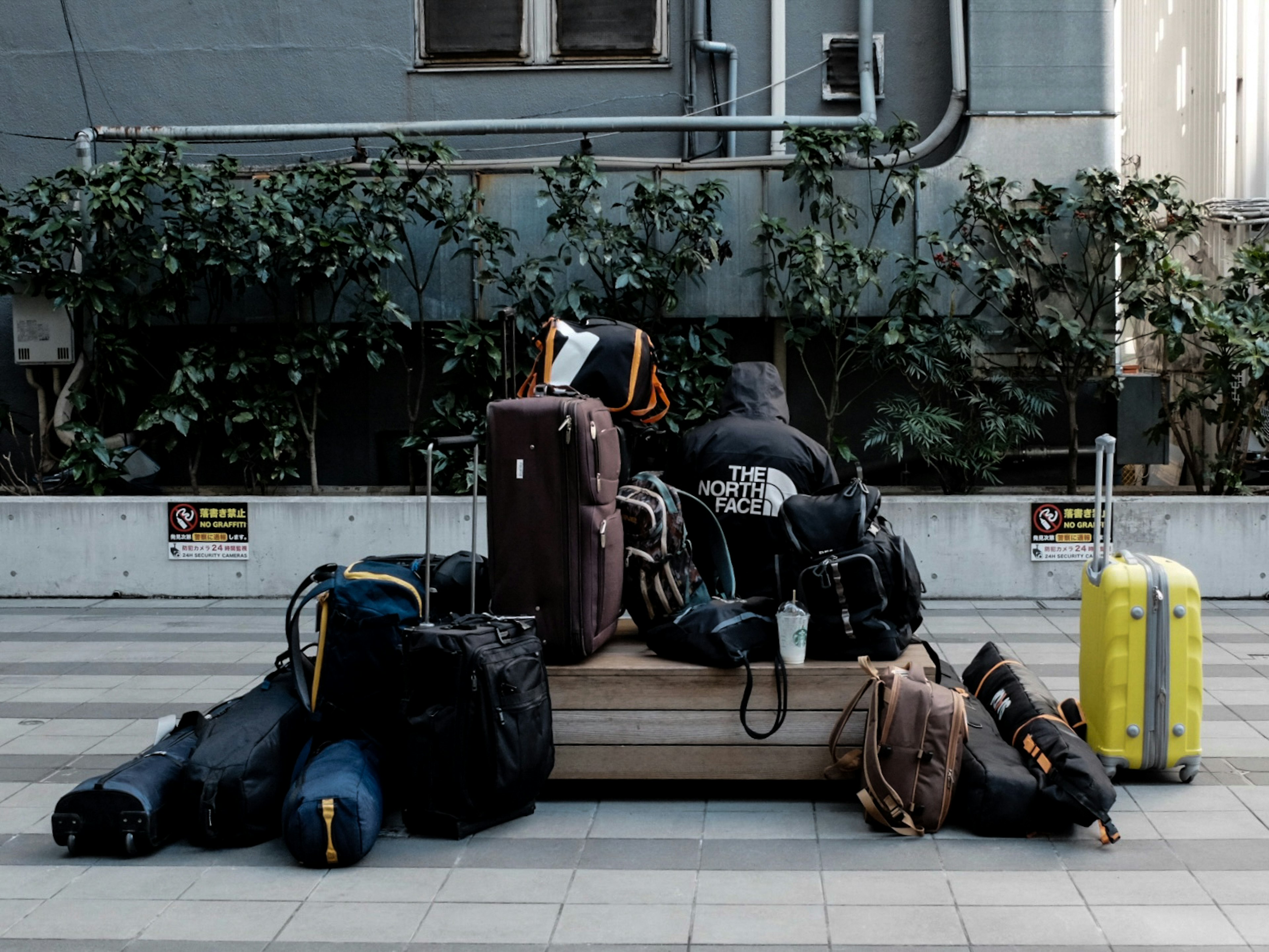 A diverse collection of luggage stacked together