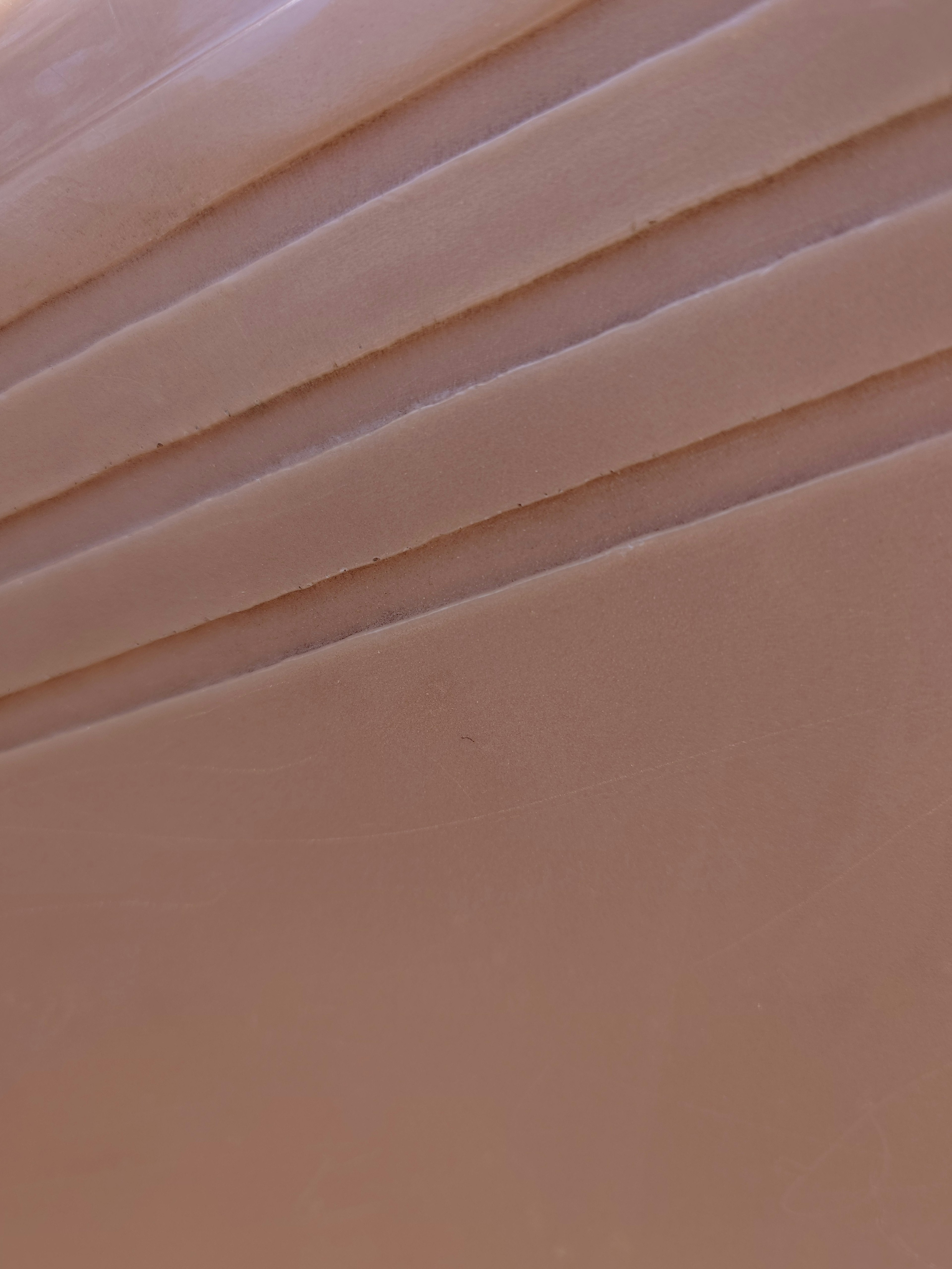 Smooth layers on a soft cream-colored surface