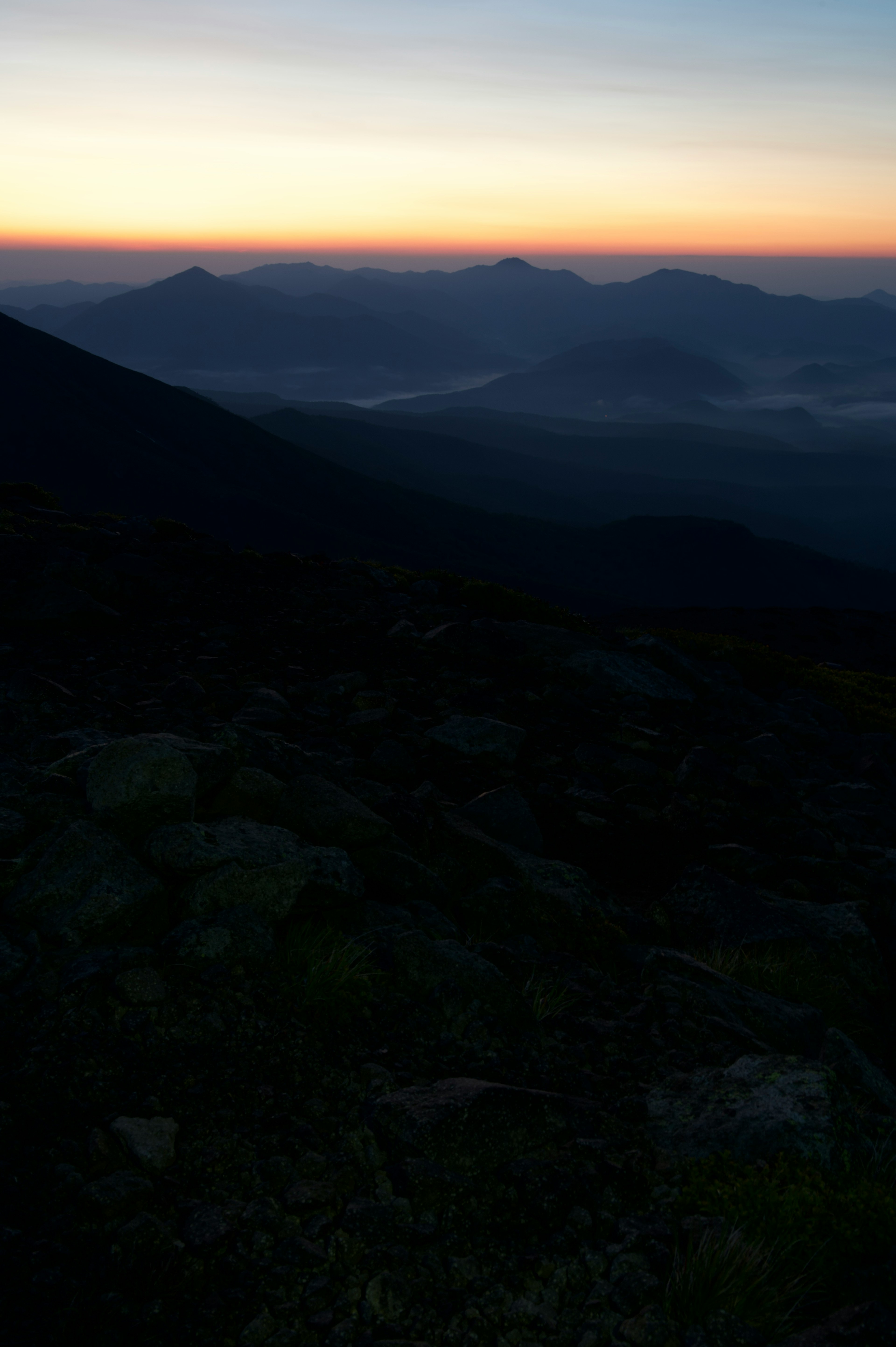 Beautiful sunrise landscape from a mountain with a gradient of blue and orange