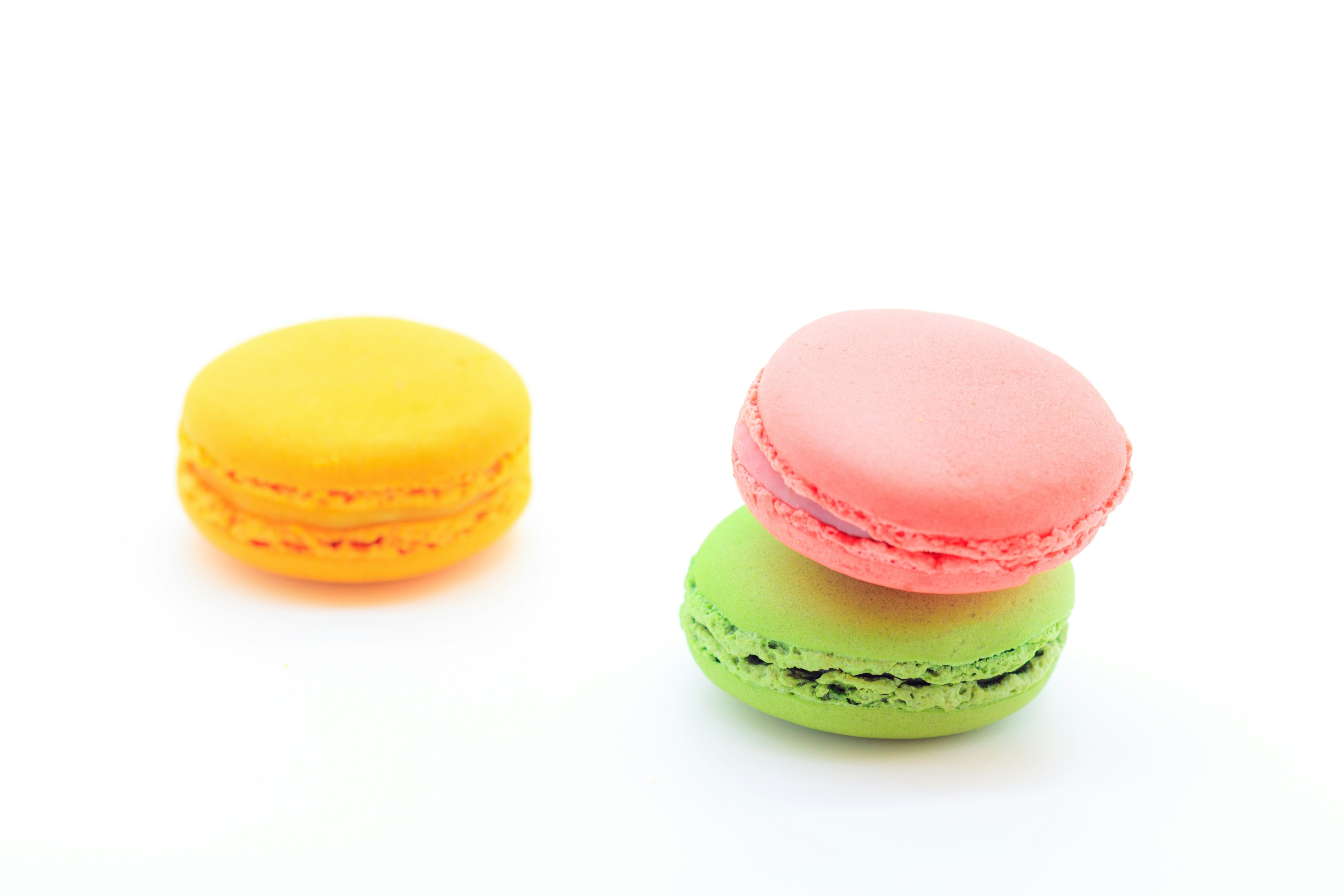 Colorful macarons placed on a white background