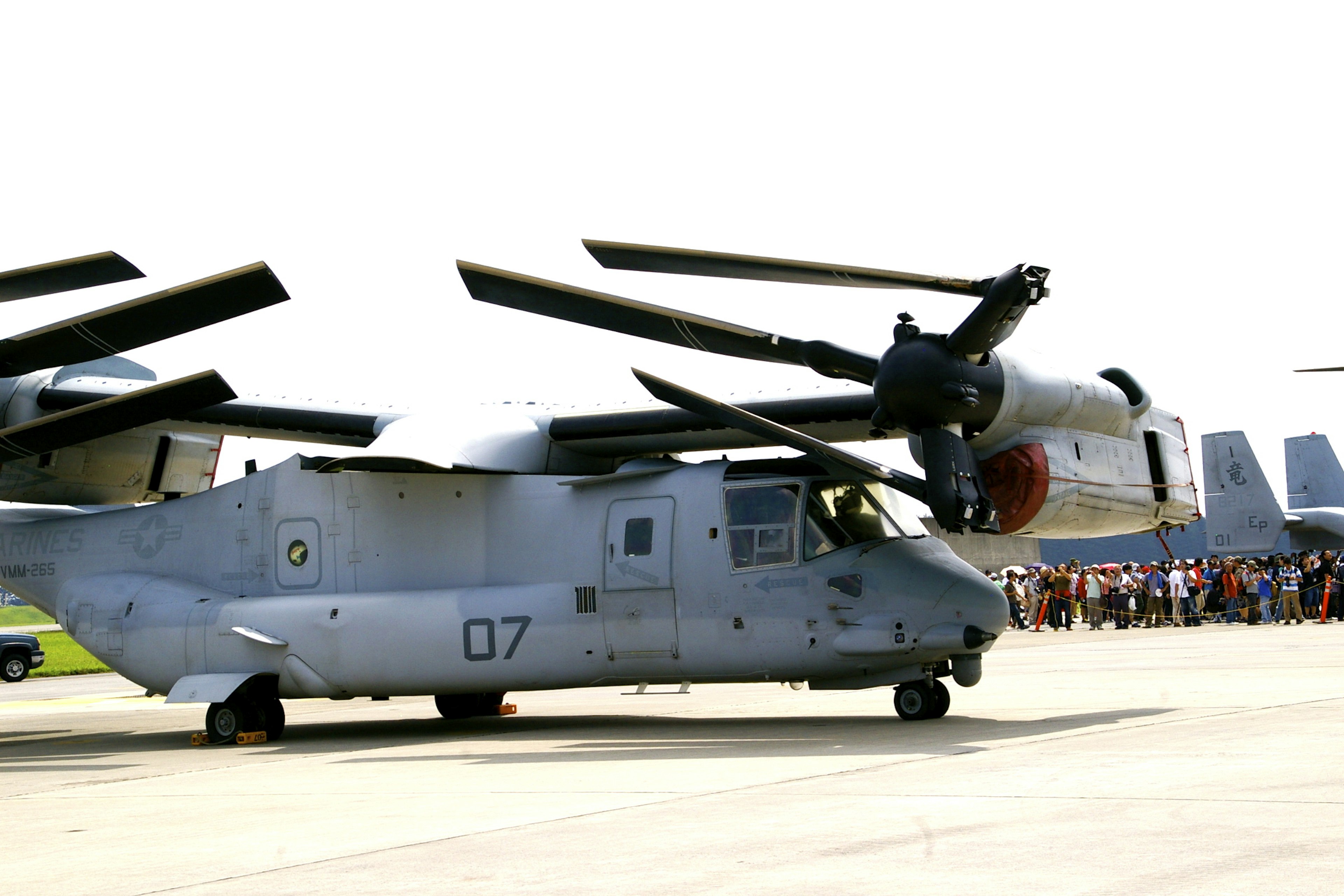 Military aircraft display featuring a V-22 Osprey side view