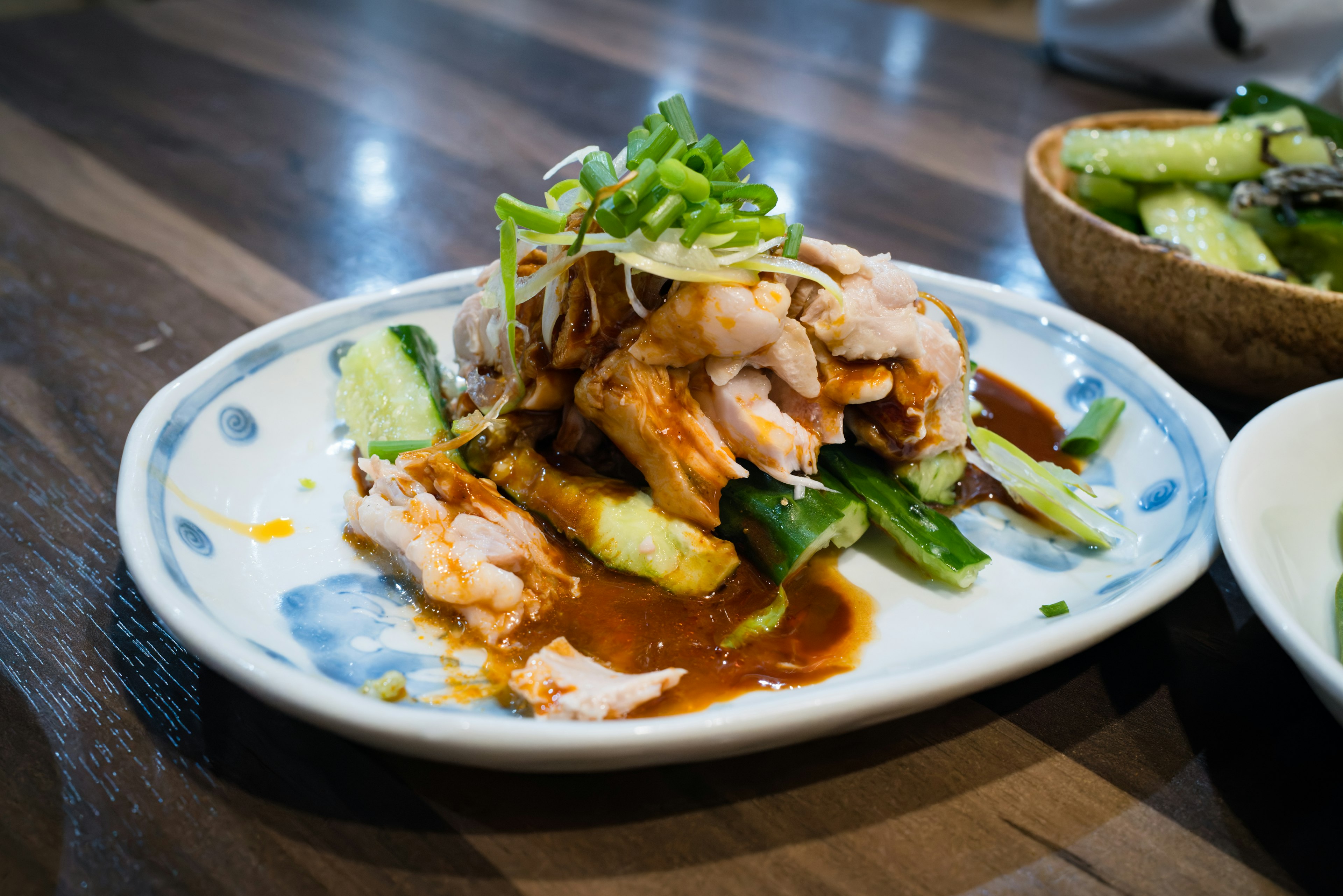 Dish featuring chicken and vegetables on a decorative plate