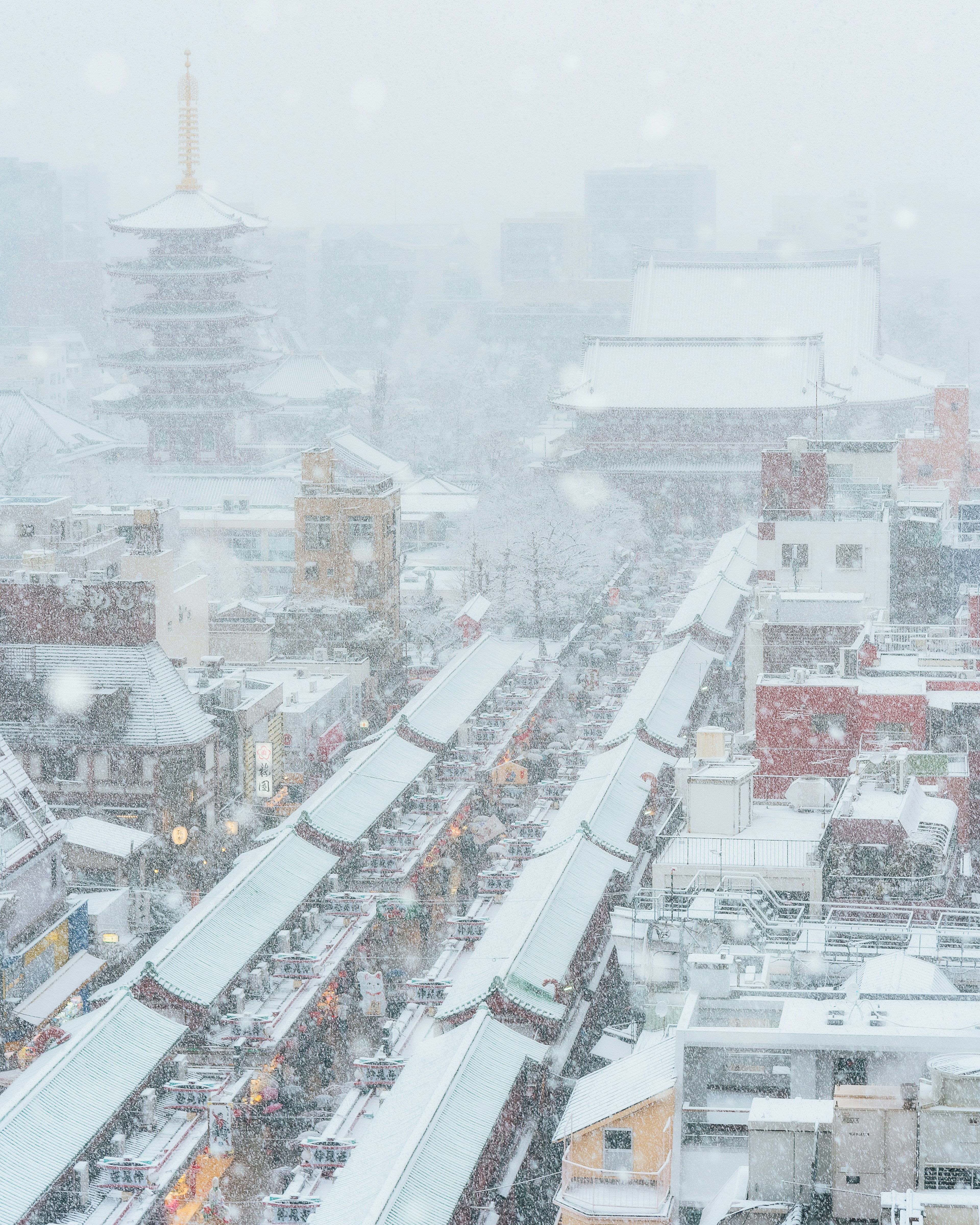 Snowy Tokyo streets with a pagoda in the background