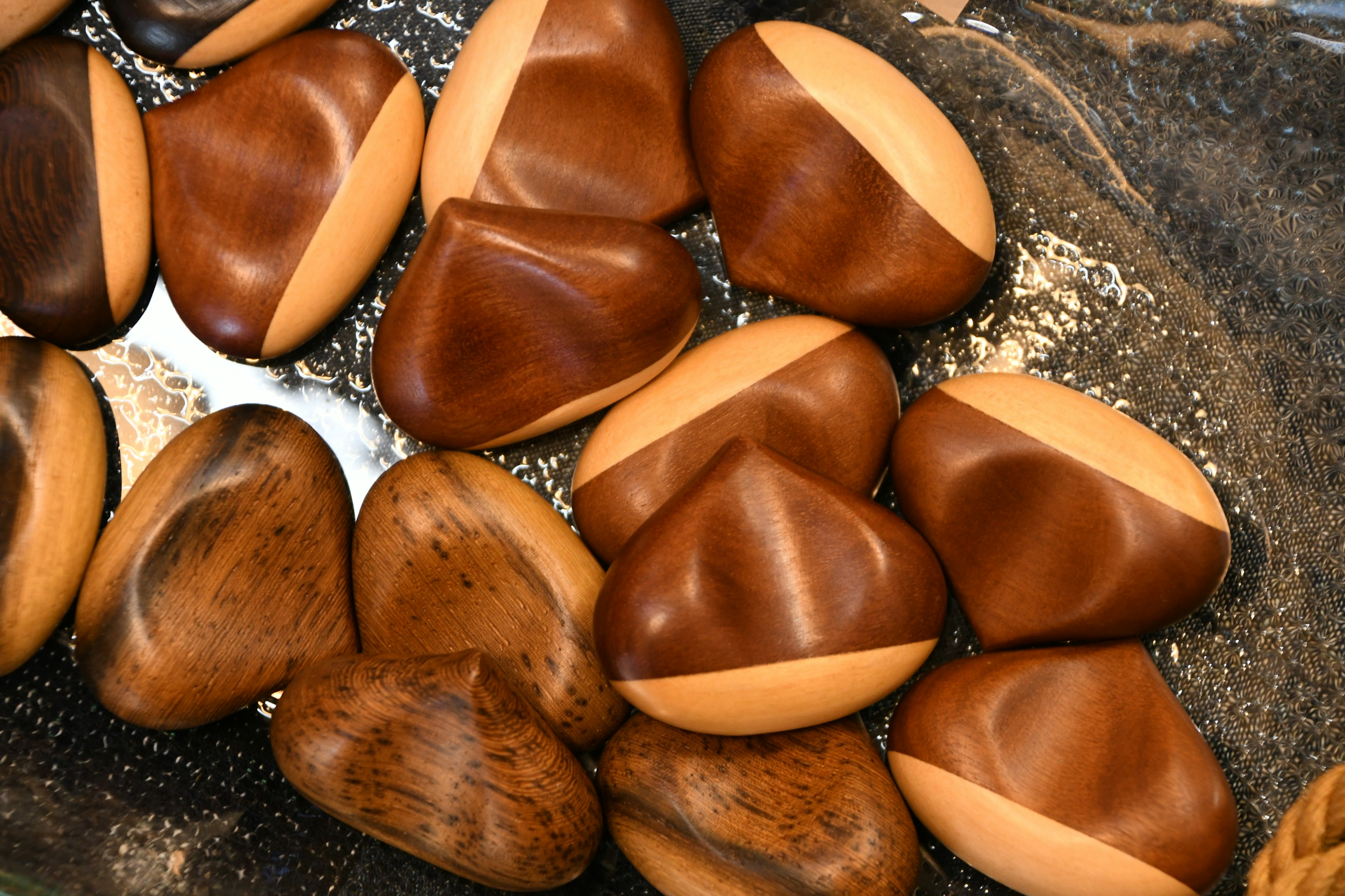 A collection of ceramic-like objects in brown and beige colors arranged together