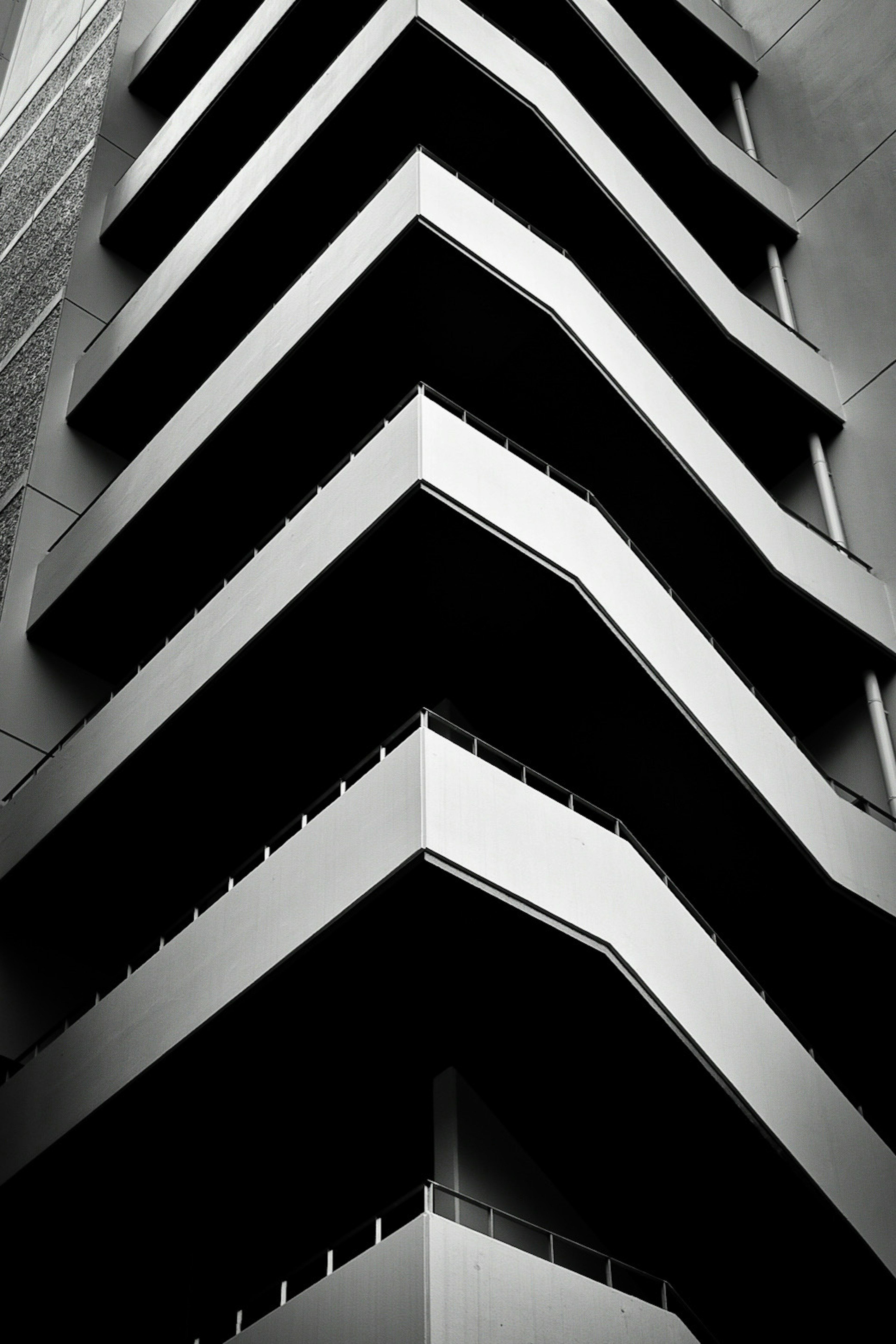 Building exterior featuring zigzag balconies in black and white