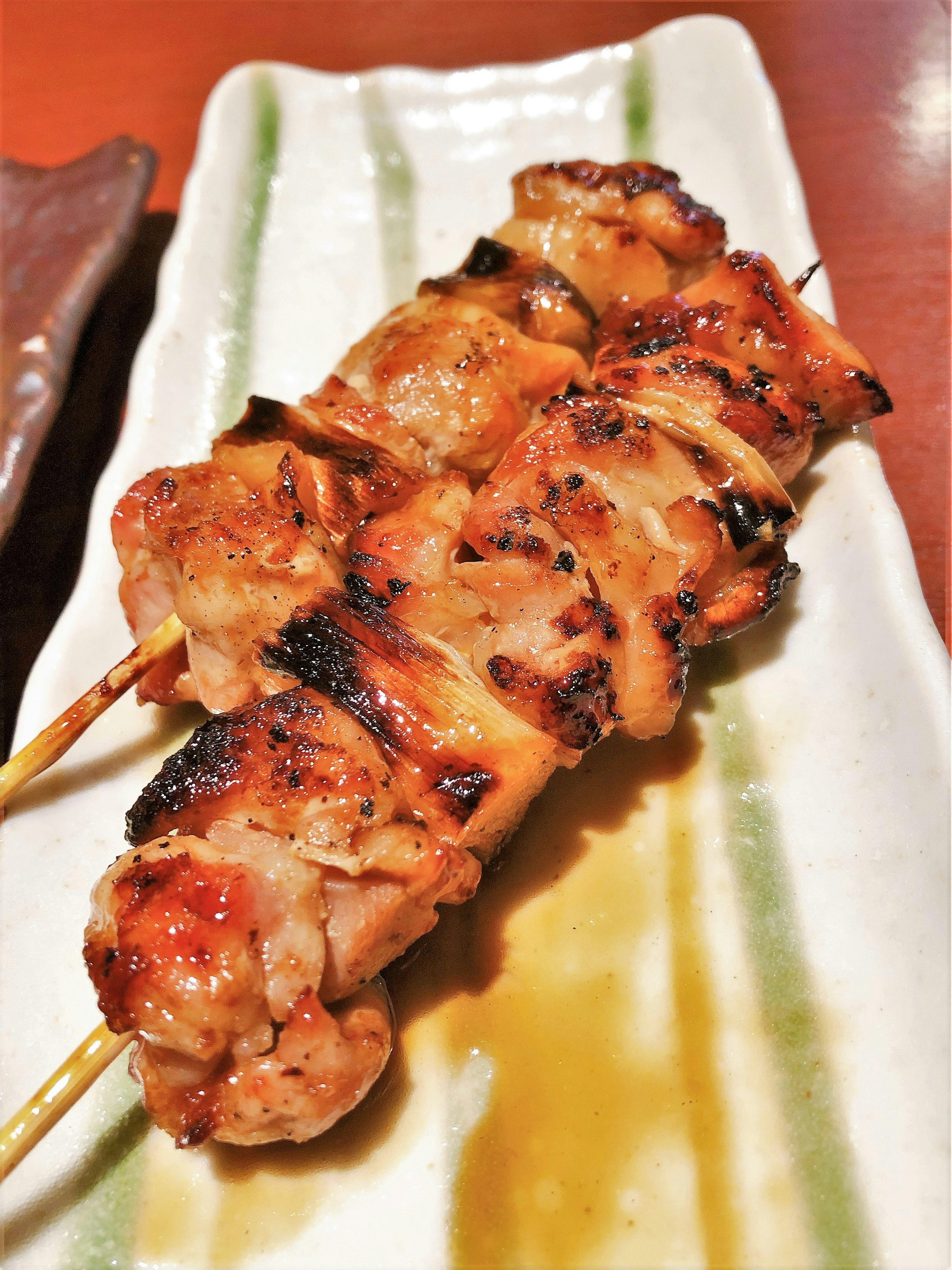 Grilled chicken skewers served on a plate