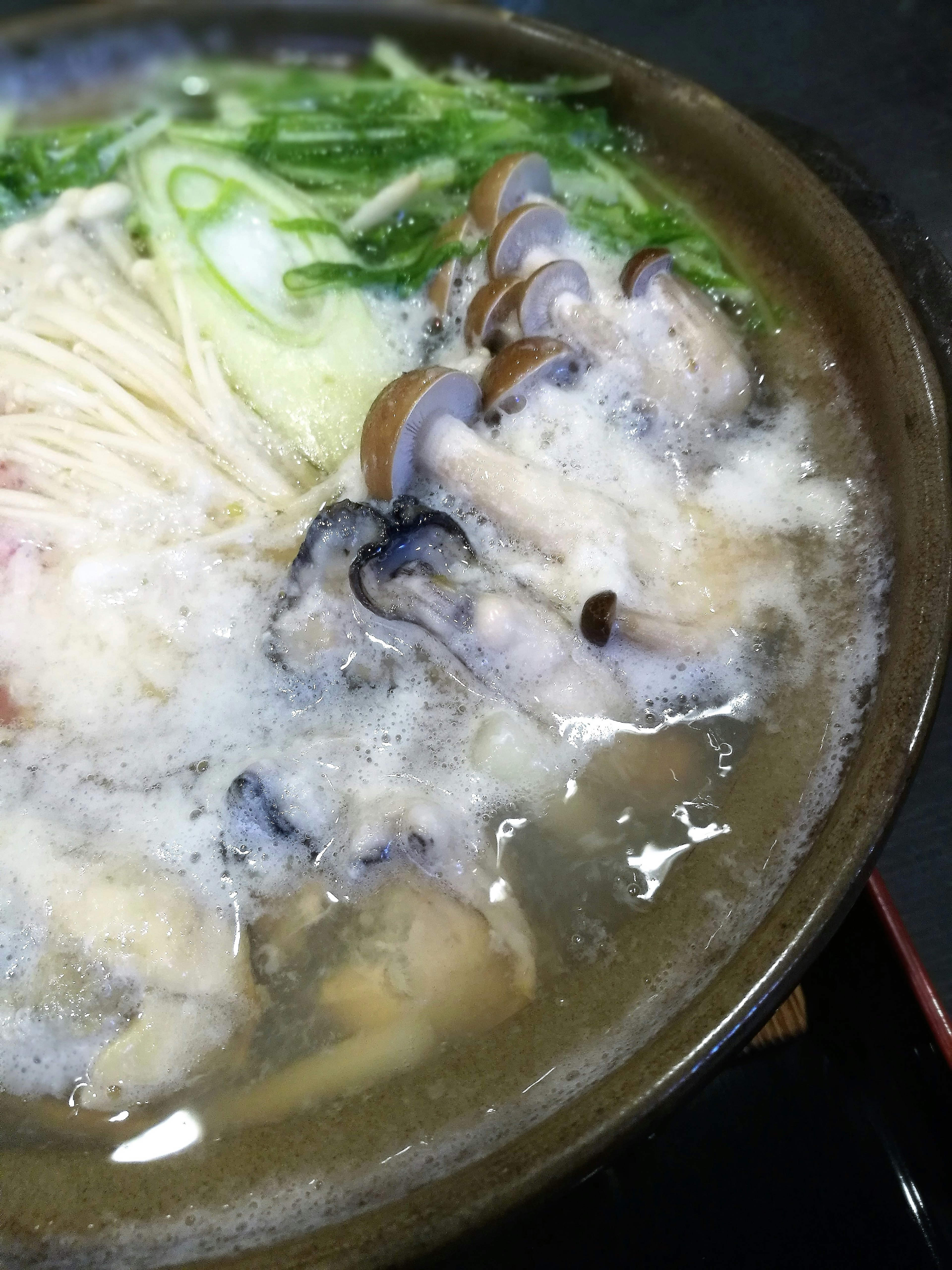 A hot pot dish featuring various ingredients in a broth