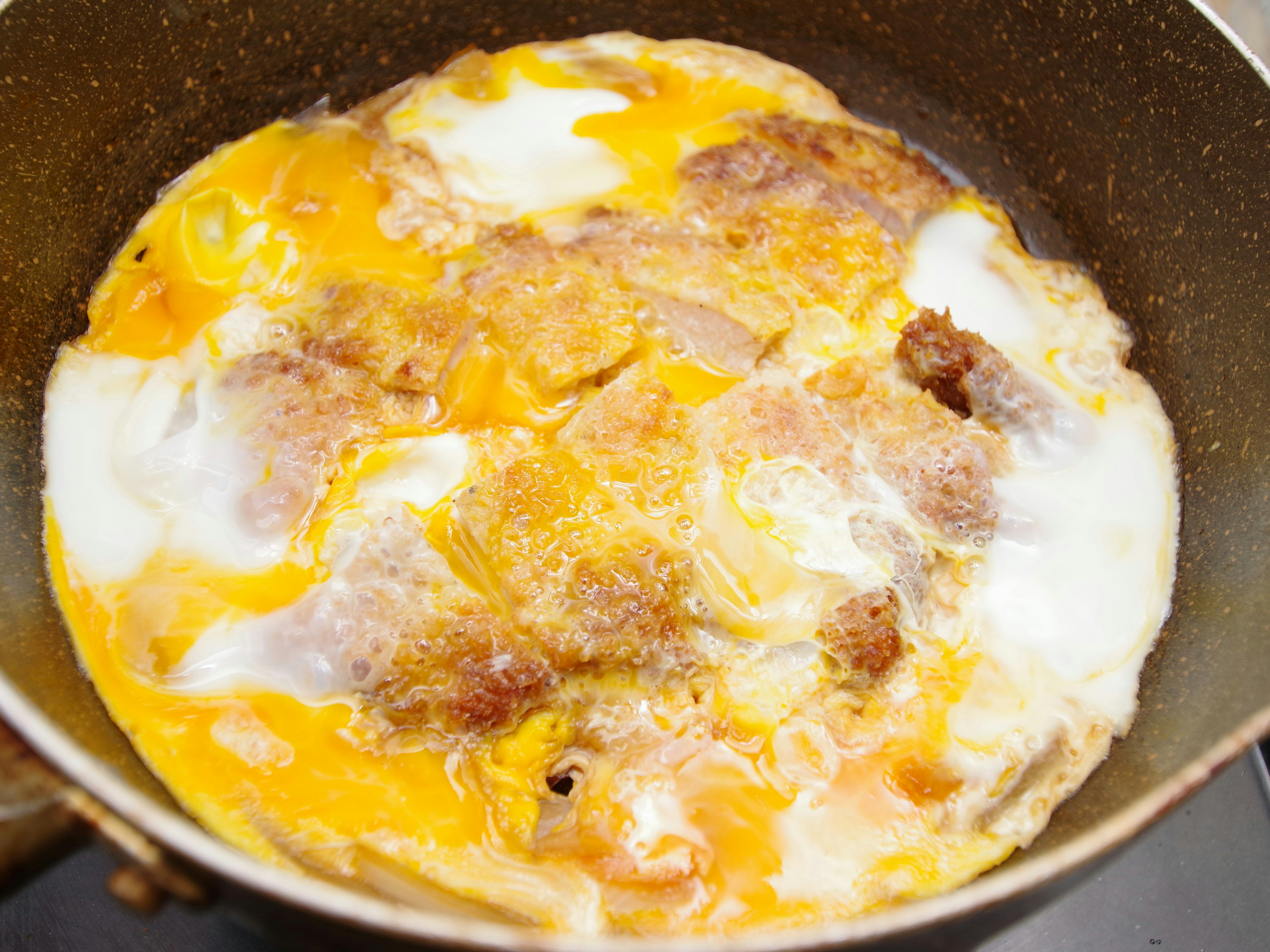 Image of a fried egg dish in a pan