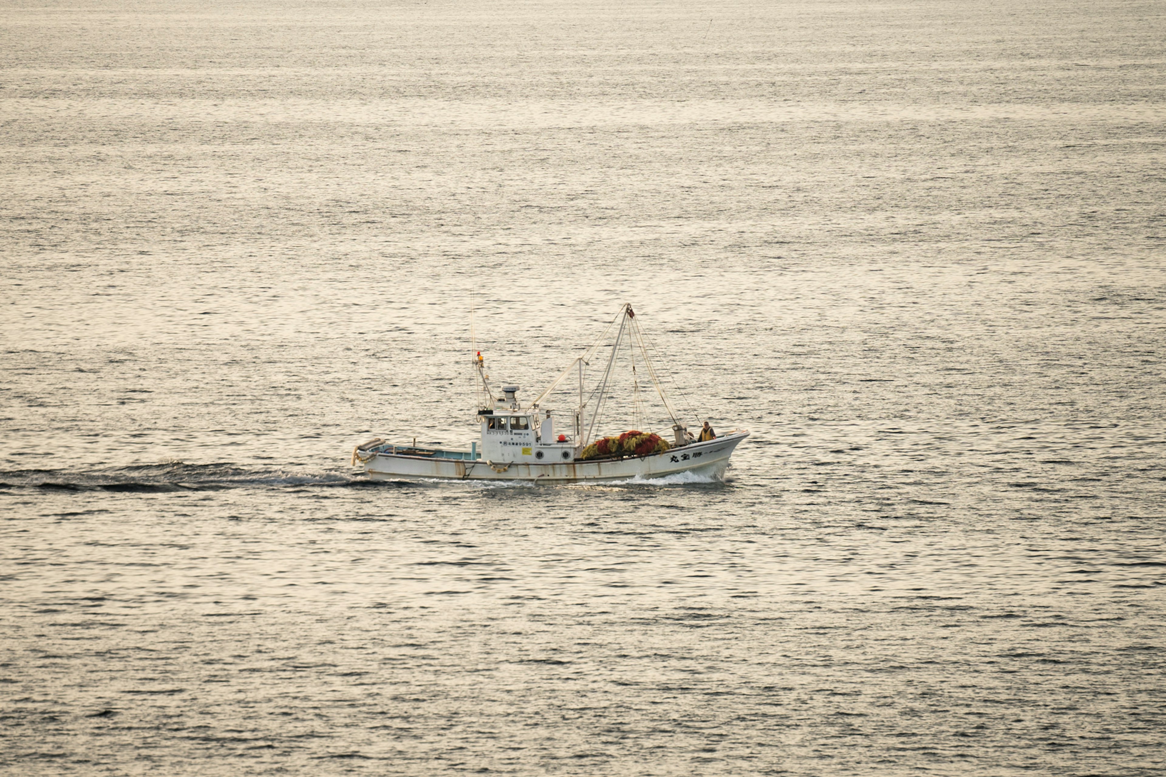 Fishing boat navigating calm waters