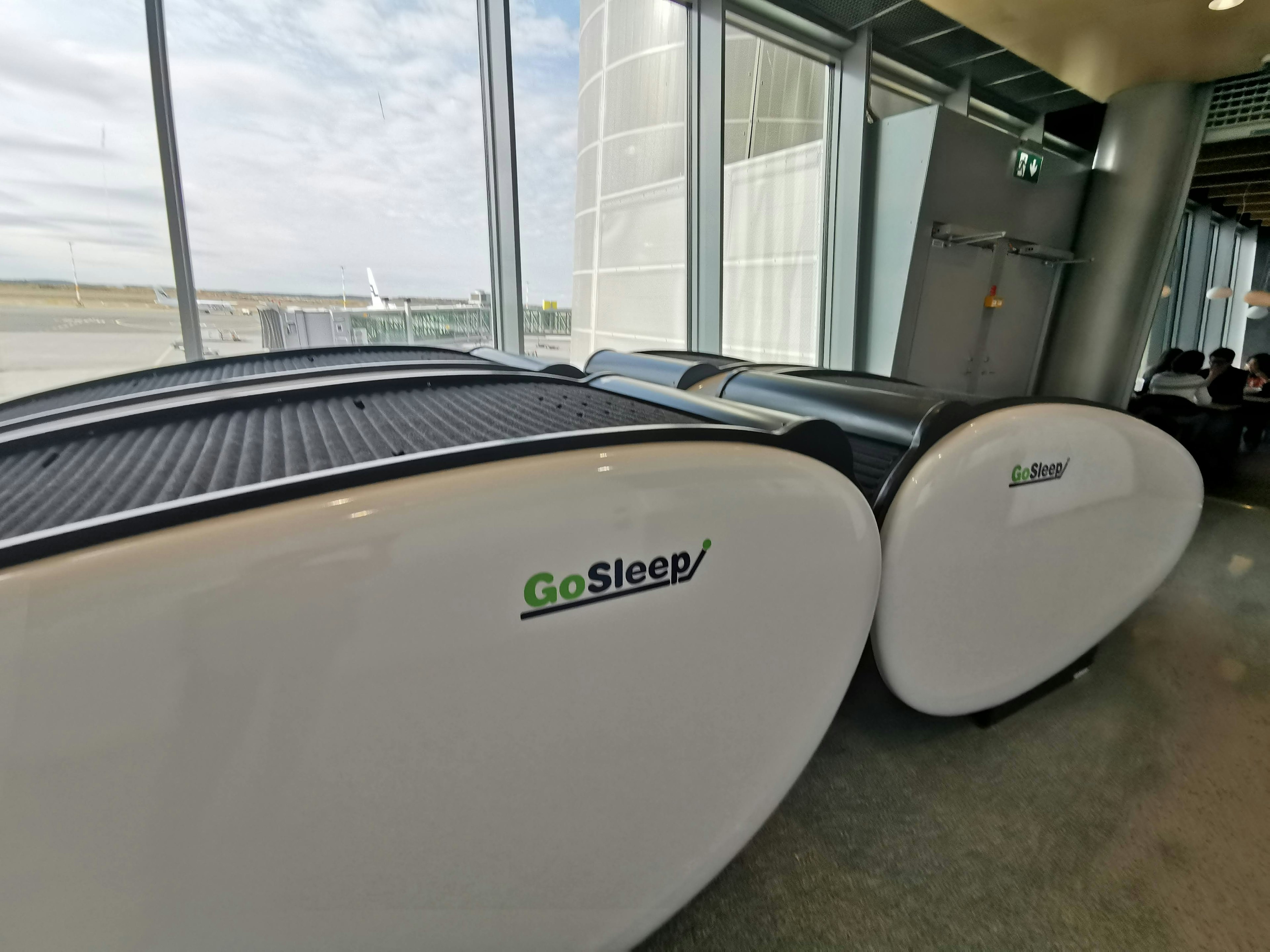 GoSleep resting capsules in an airport waiting area