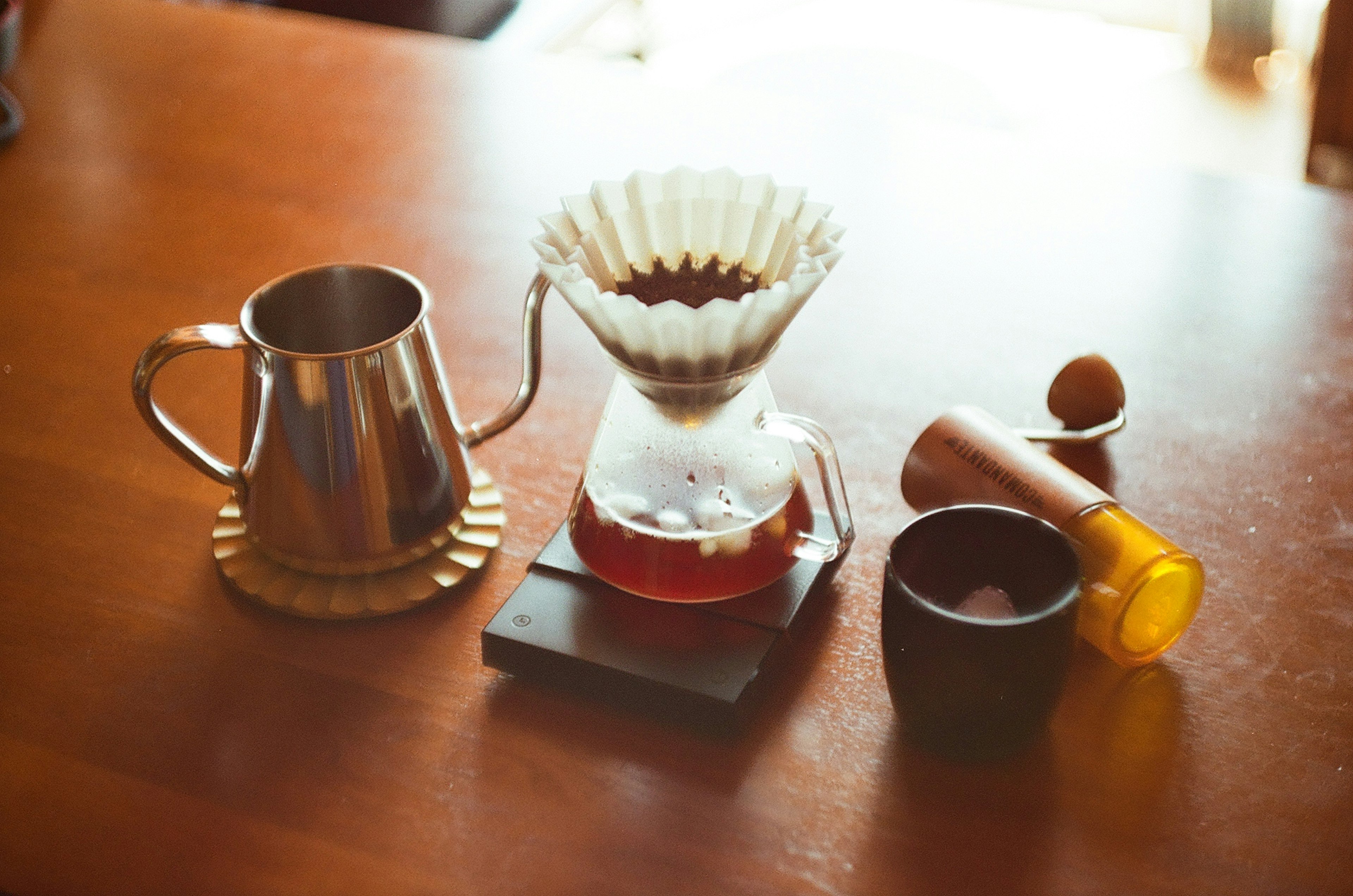 A scene of coffee brewing equipment on a table