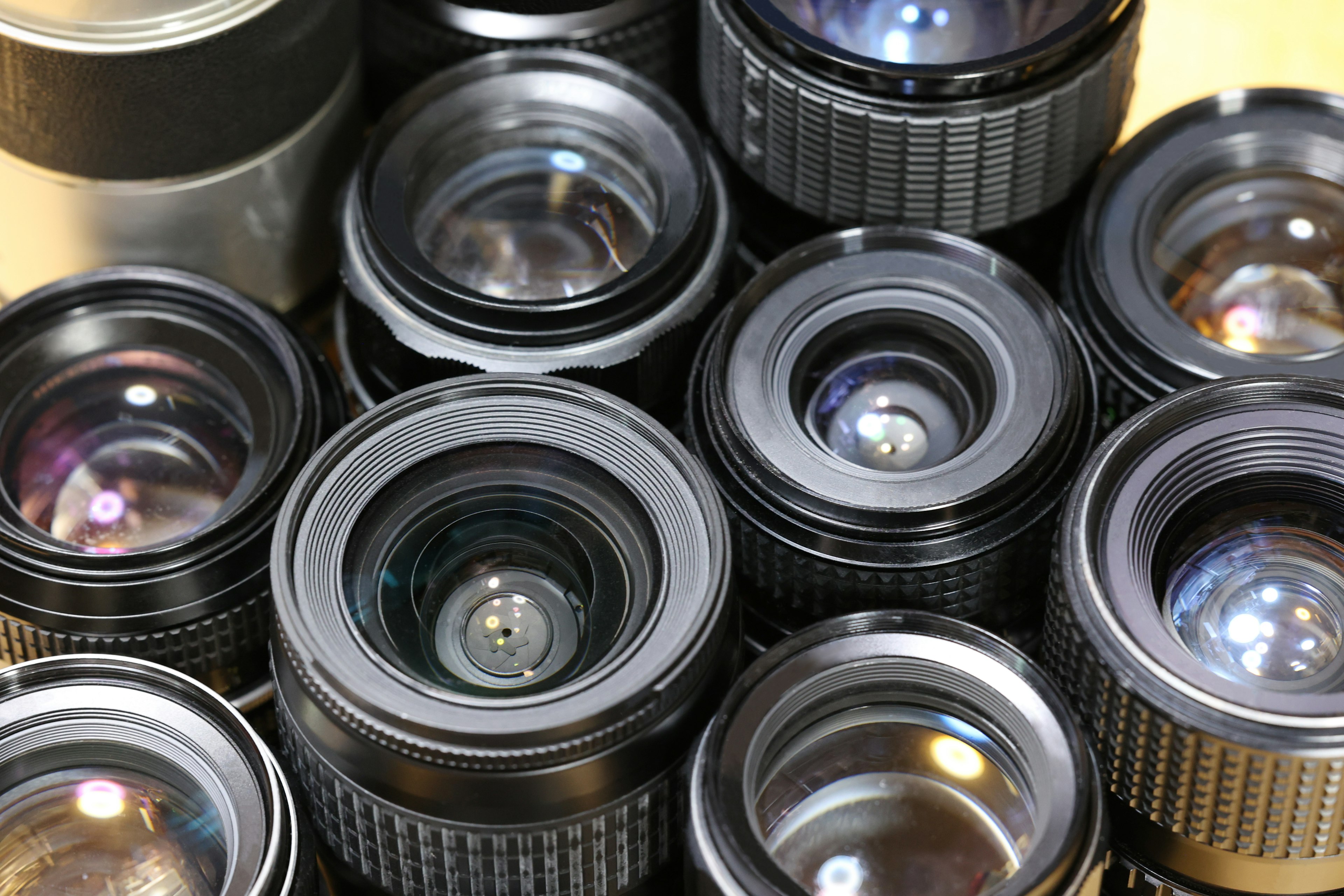 A collection of camera lenses arranged in a close-up view