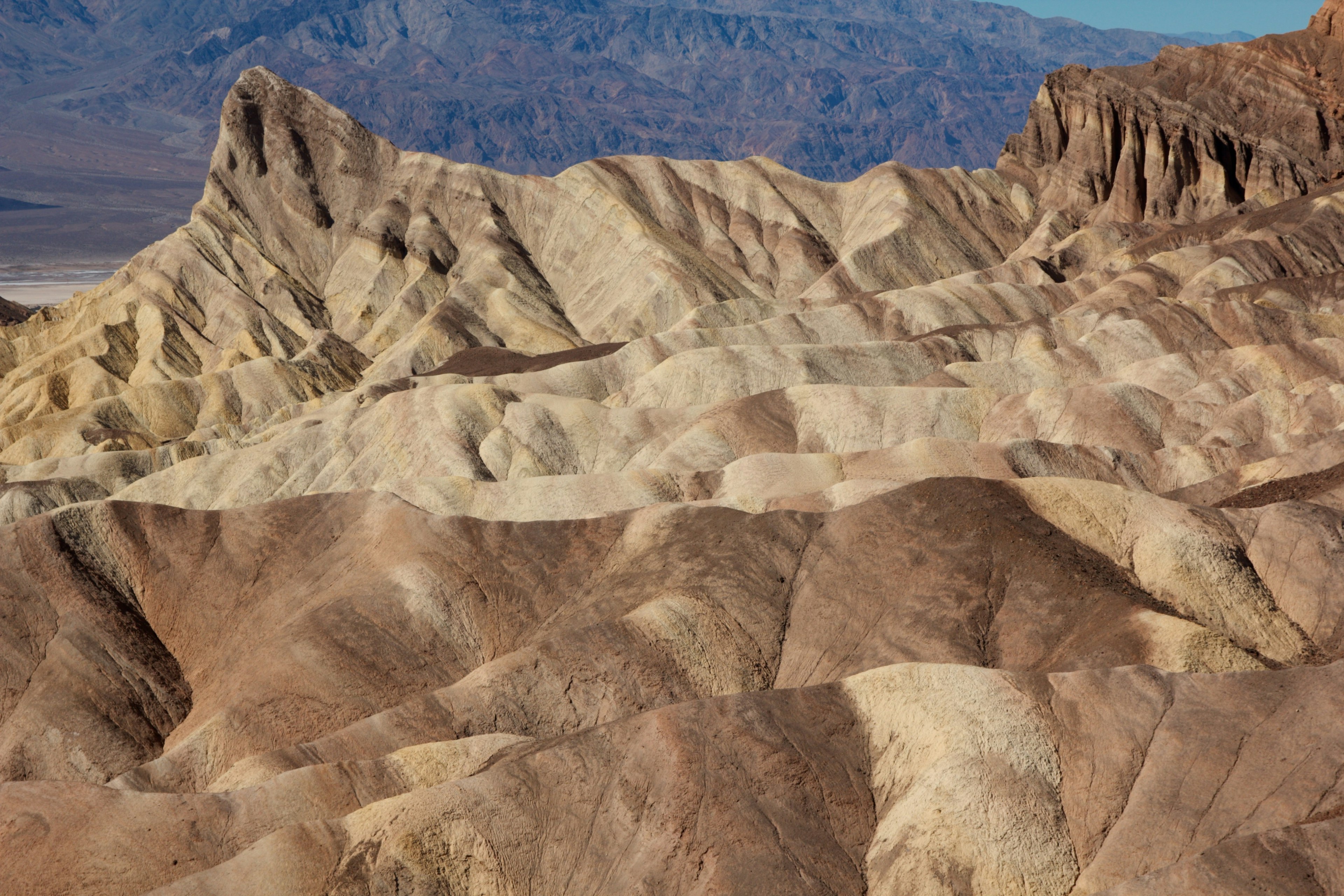 Vast landscape of colorful sedimentary layers in a desert